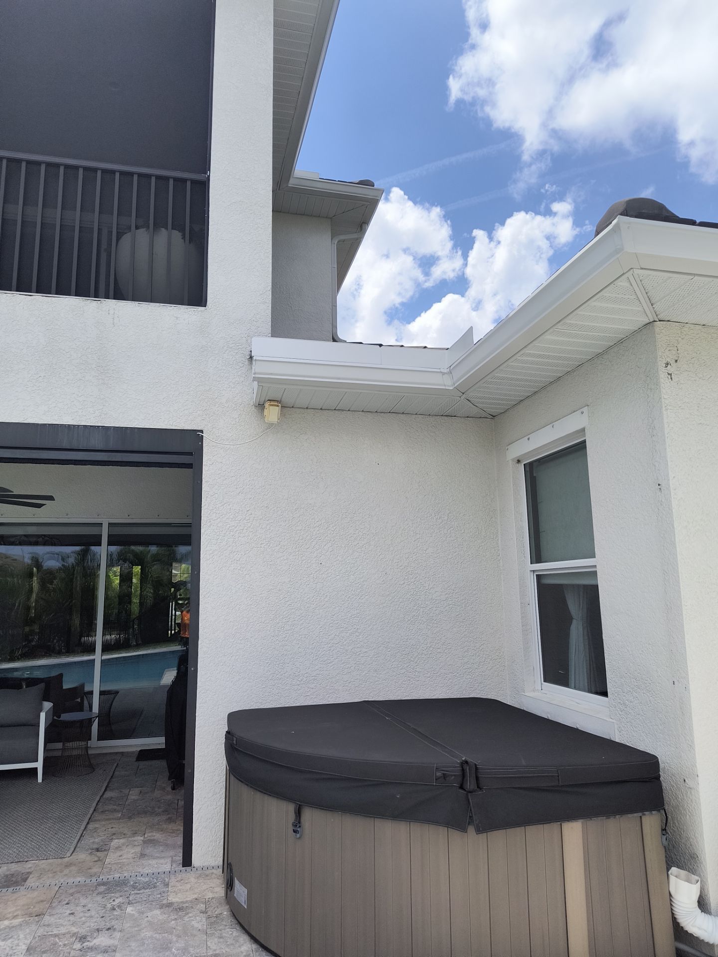 White Seamless Gutters with Downspouts in Bradenton FL by Gutter Professors