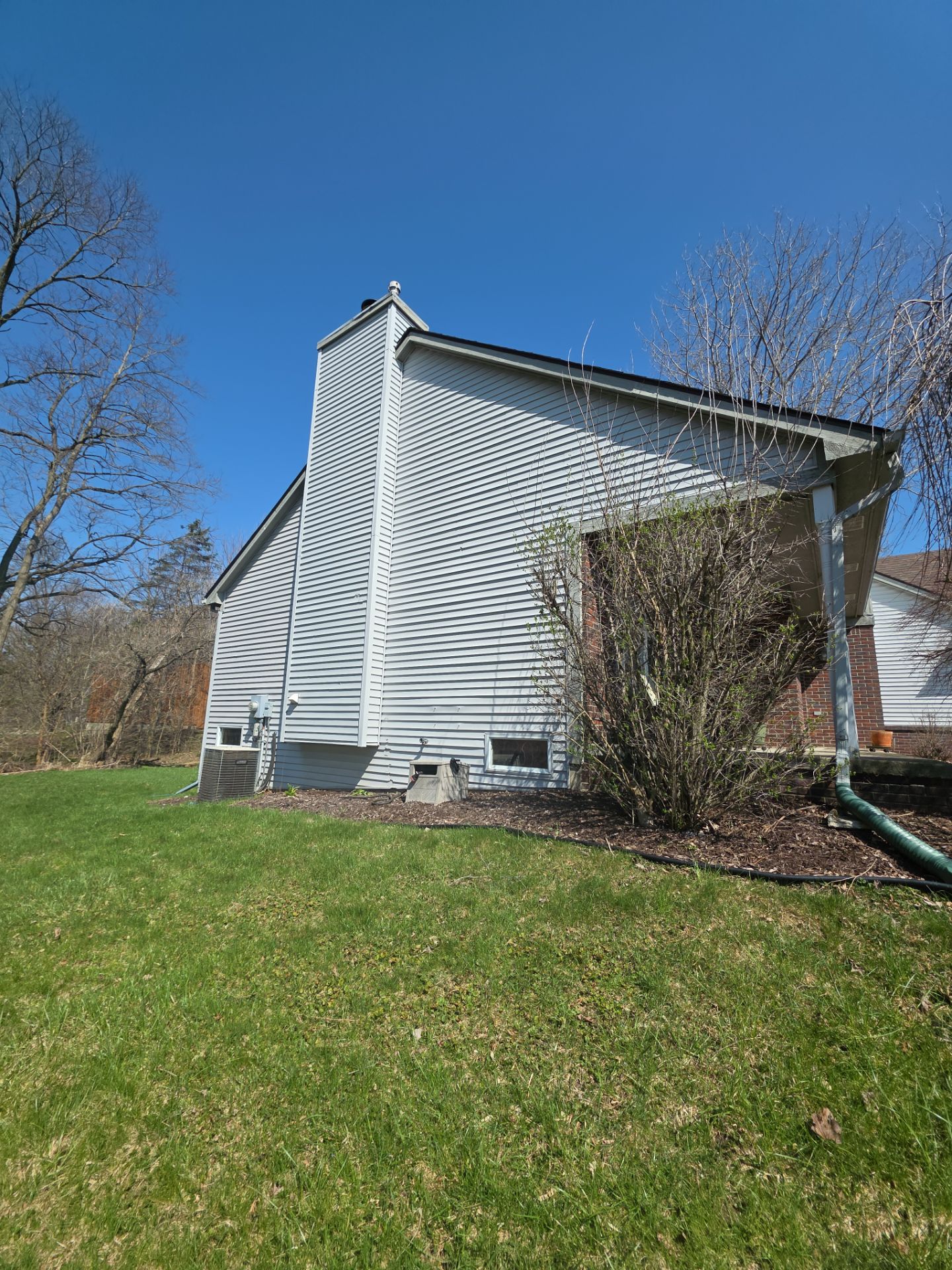 Exterior Siding and Wood Trim Restoration in Ypsilanti by Top Shelf Painter