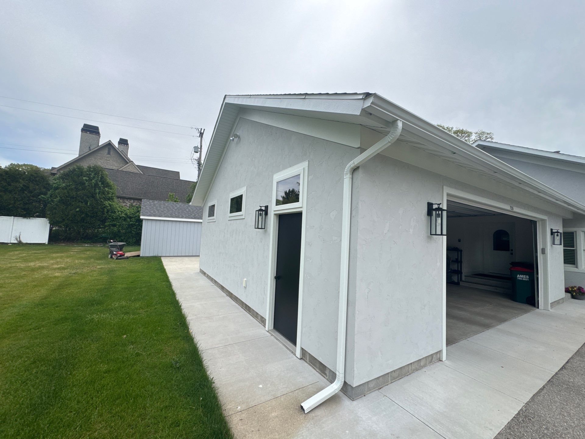 Norton Shores Residential Stucco Repair and Exterior Painting Refresh by Gordon Painting
