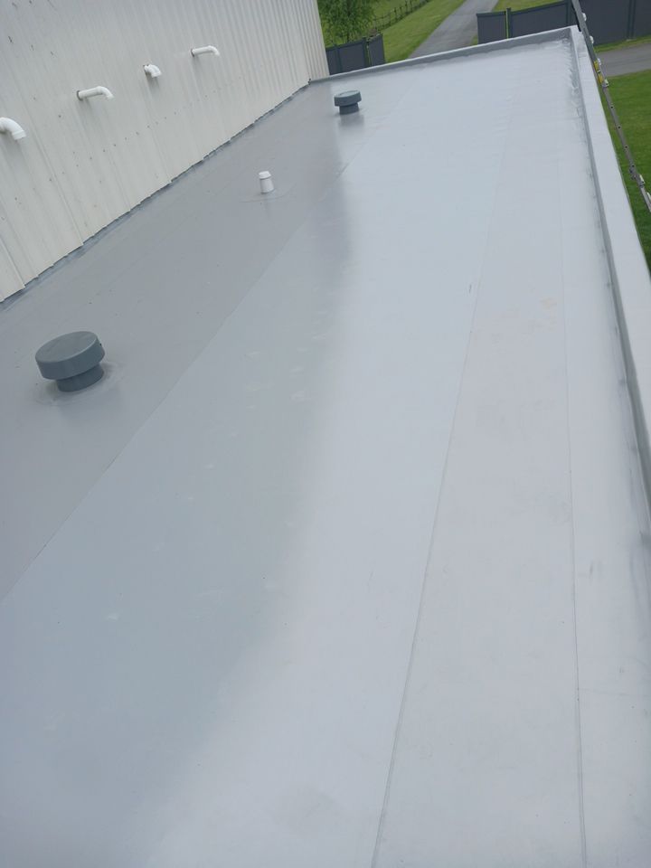 Residential Shop flat roofing Installation using Durolast membrane by Top Notch Roofing Inc
