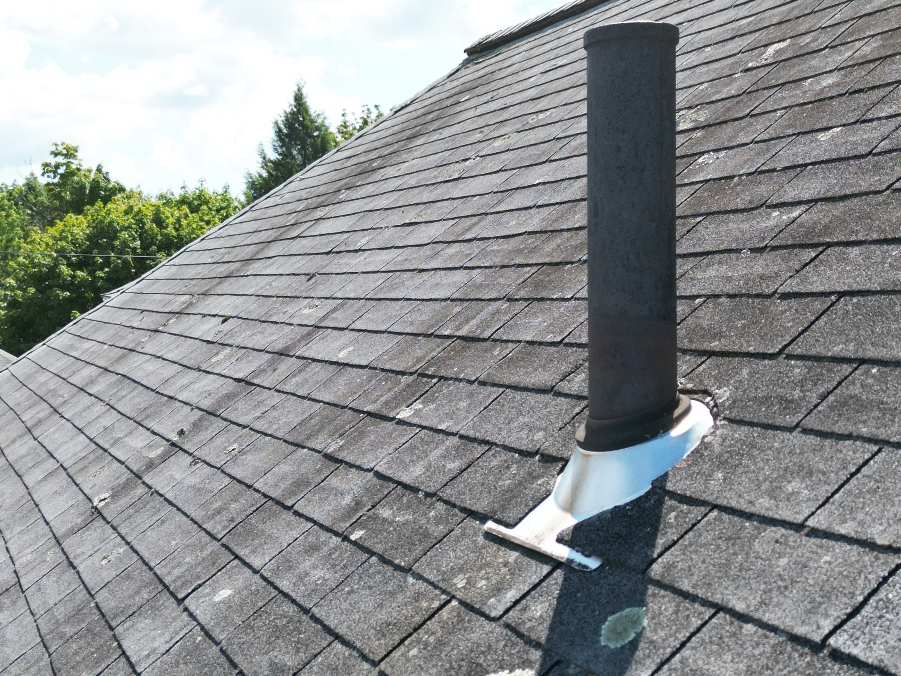Roof Replacement with Skylight Flashing in Waltham, MA by Mighty Dog Roofing of Greater Middlesex County