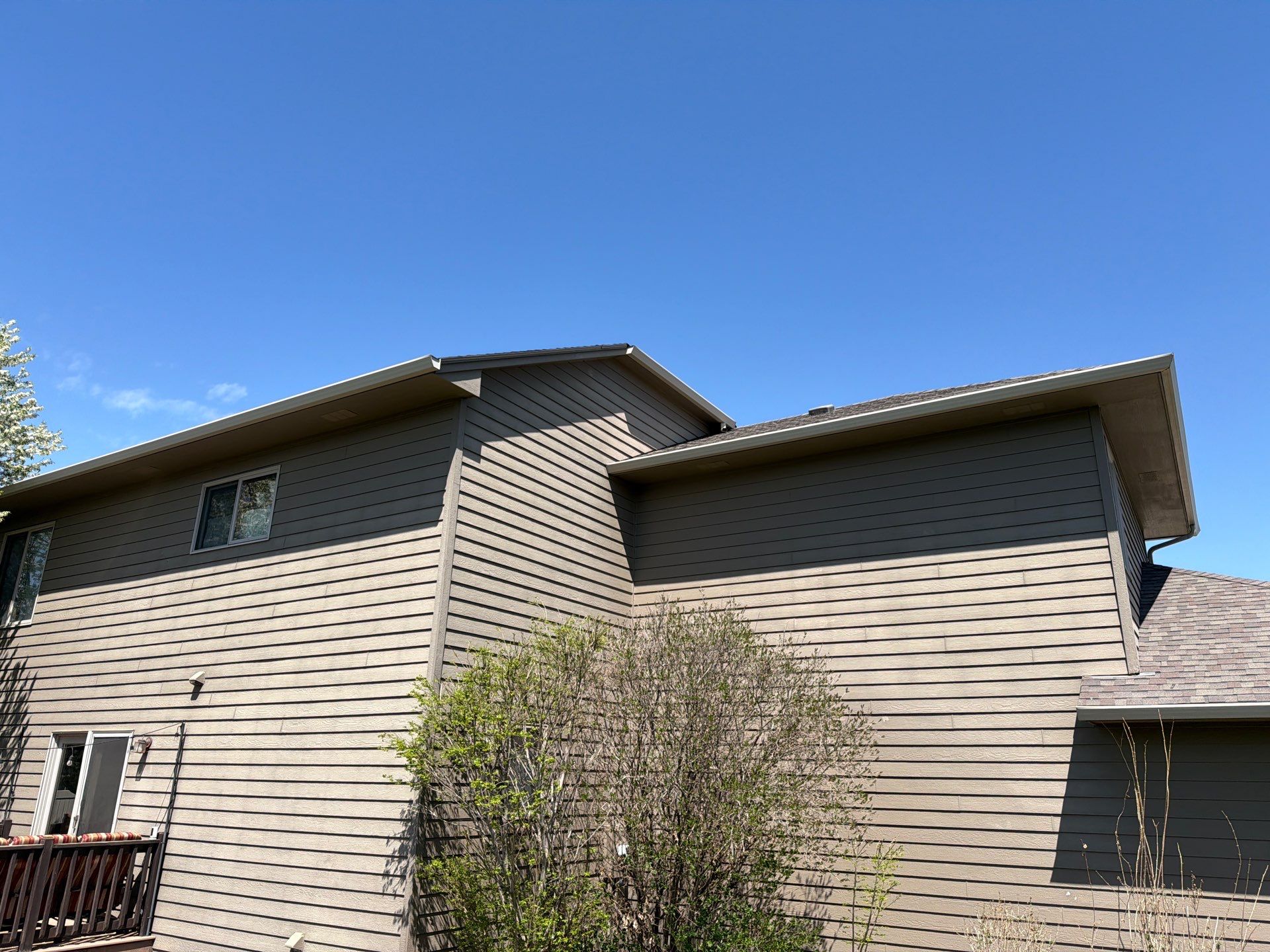 Residential Exterior Painting with Shutter and Trim Updates in Sioux Falls by Select Painting, Coatings & Garage Cabinets