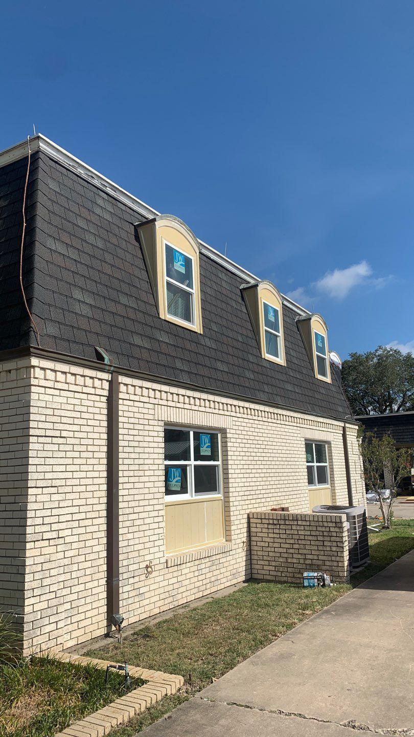 Mansard Charm by Bayfront Roofing and Construction
