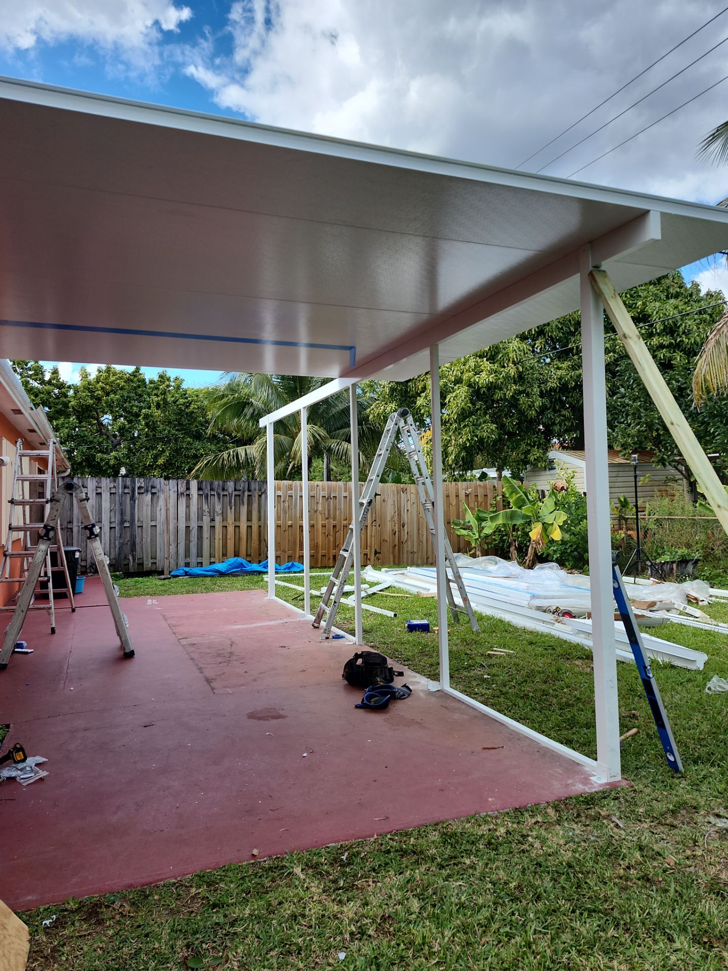 Insulated Screen Enclosure and Wood Tile Deck Installation in Plantation by Aastro Roofing