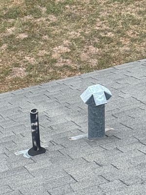 Plumbing vent pipes on architectural asphalt shingle roof