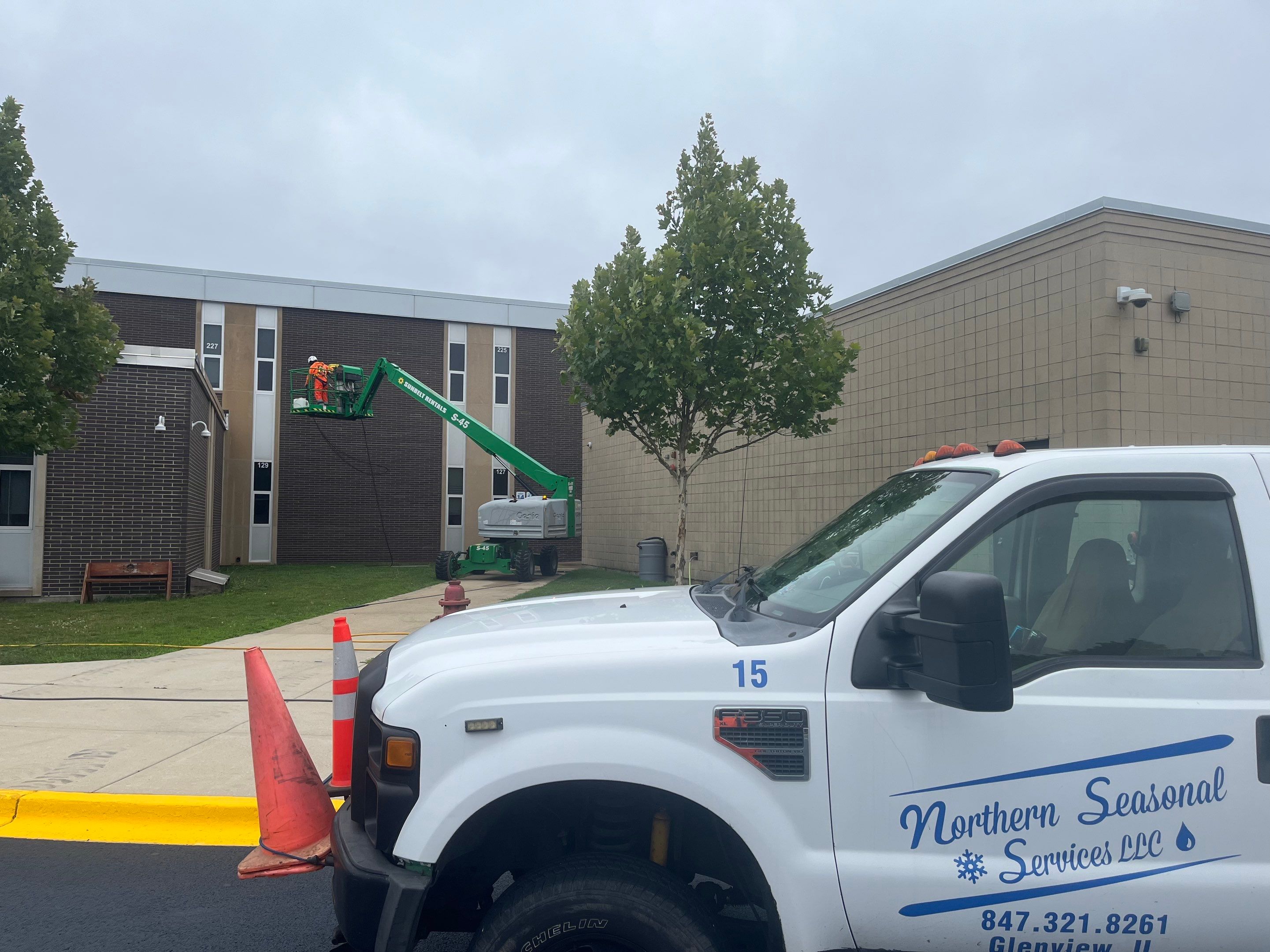 commercial pressure washing using Algaecide, soft wash soap by Northern Power Washing LLC.