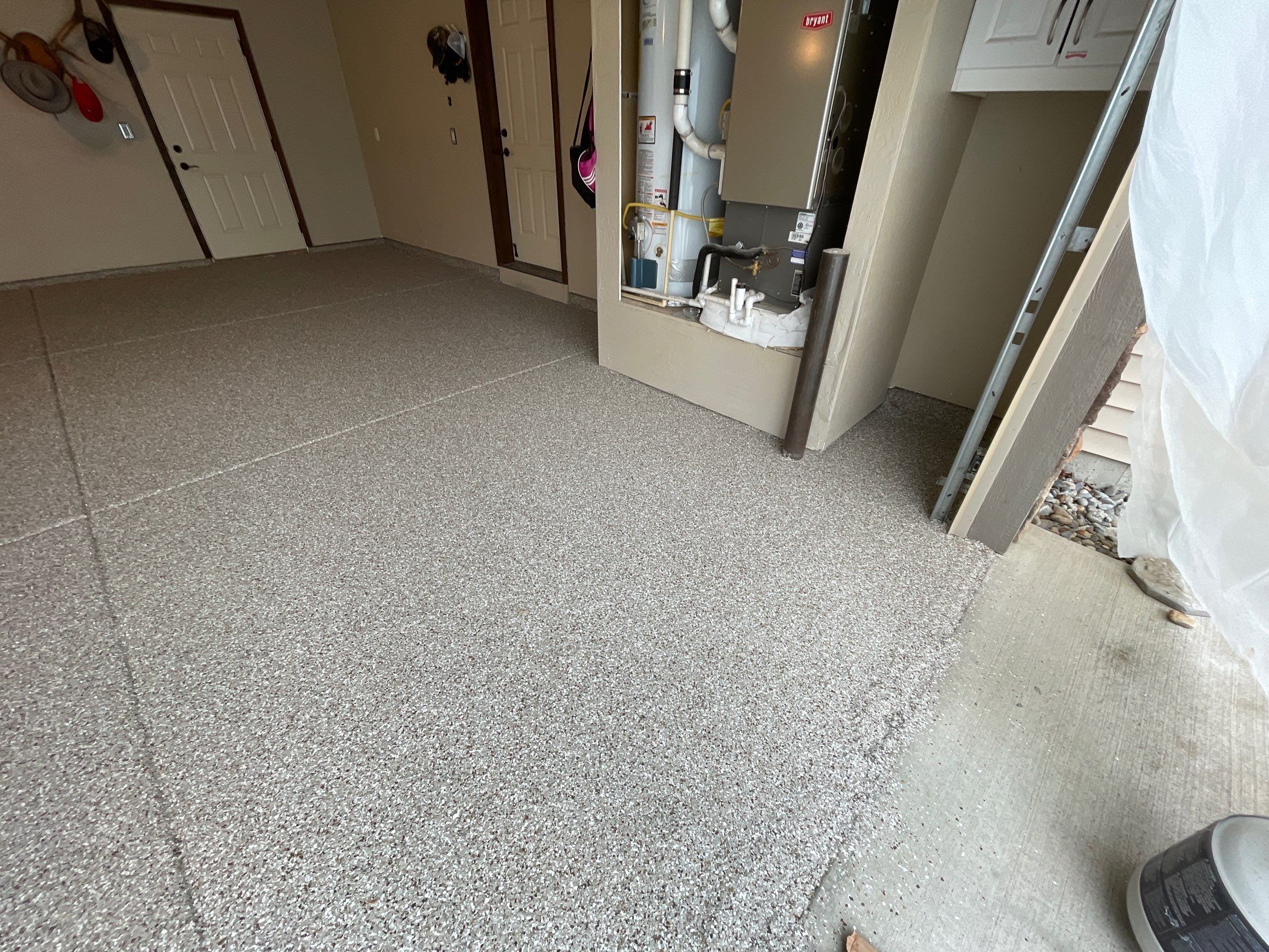 Garage Transformation using Pebble Beach and Front Porch using Greystone by Croc Coatings, LLC