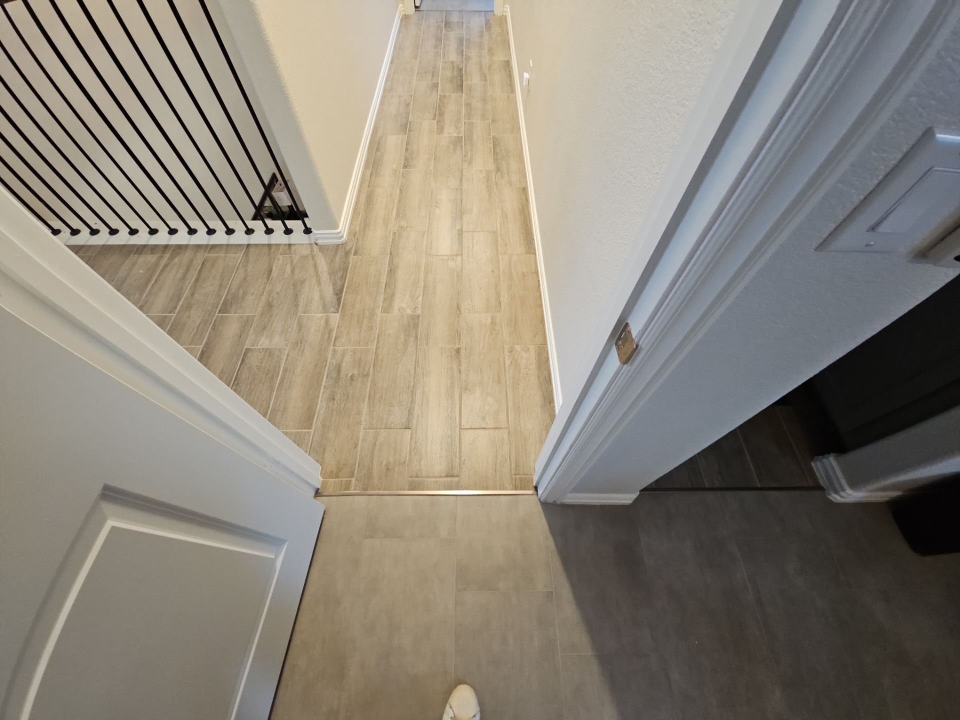 Carpet replacement with Tile and Red Oak Stairs by EL-GC LLC 