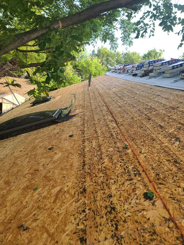 Impact Resistant Roof Replacement and Skylight Project in Norman Oklahoma by McCann's Roofing and Construction