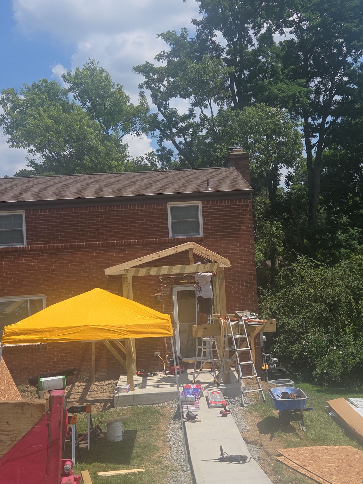 Concret and roof build  by Cousins Roofing Siding & Decks