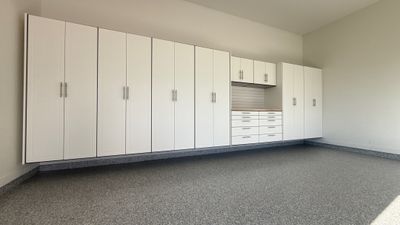 Garage Remodel with Custom Cabinets and Epoxy Floors in Overland Park