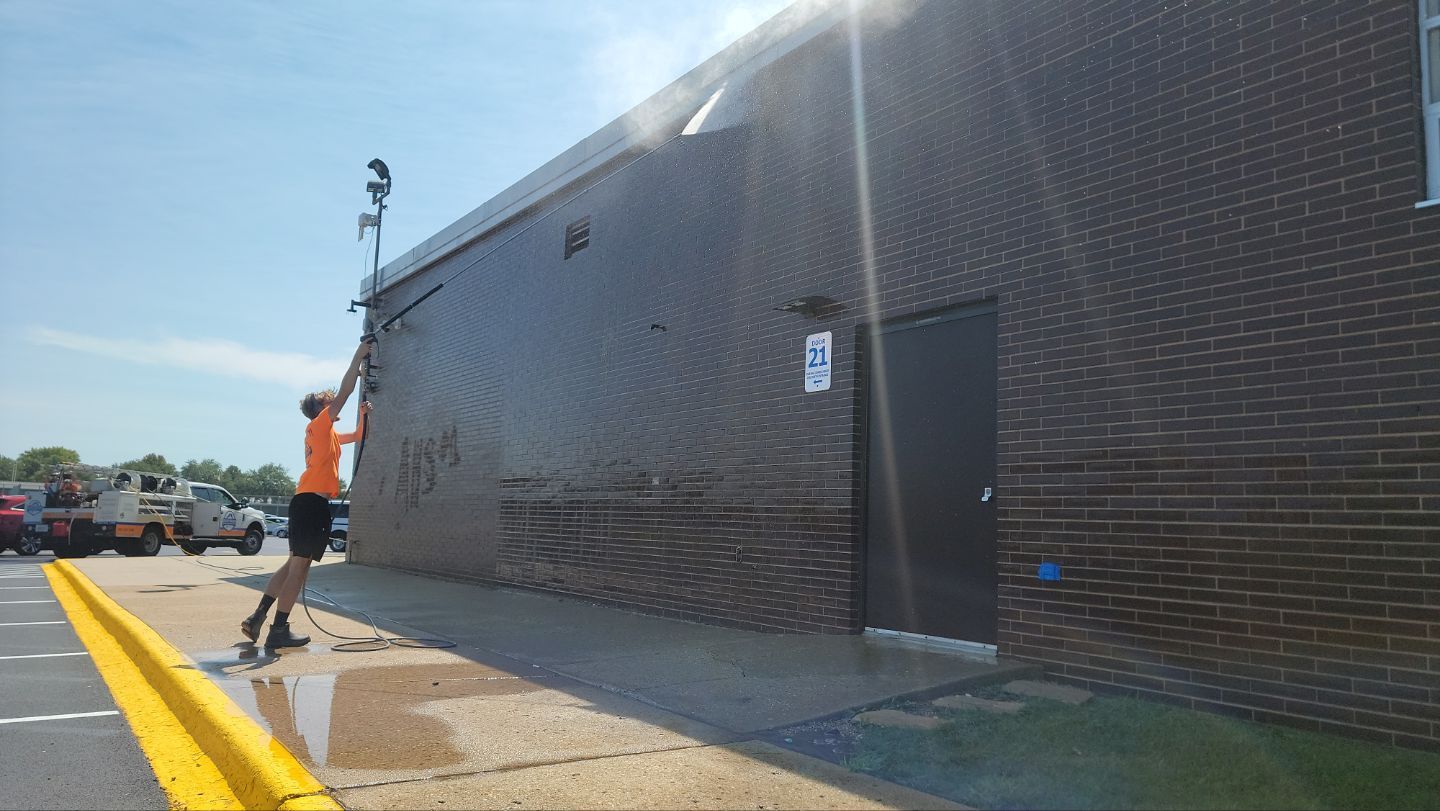 commercial pressure washing using Algaecide, soft wash soap by Northern Power Washing LLC.