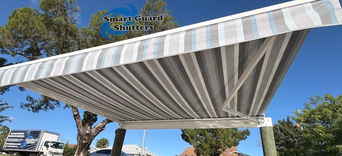 Retractable Awning in Sunbrella Marco Blue Grey by Smart Guard Shutters