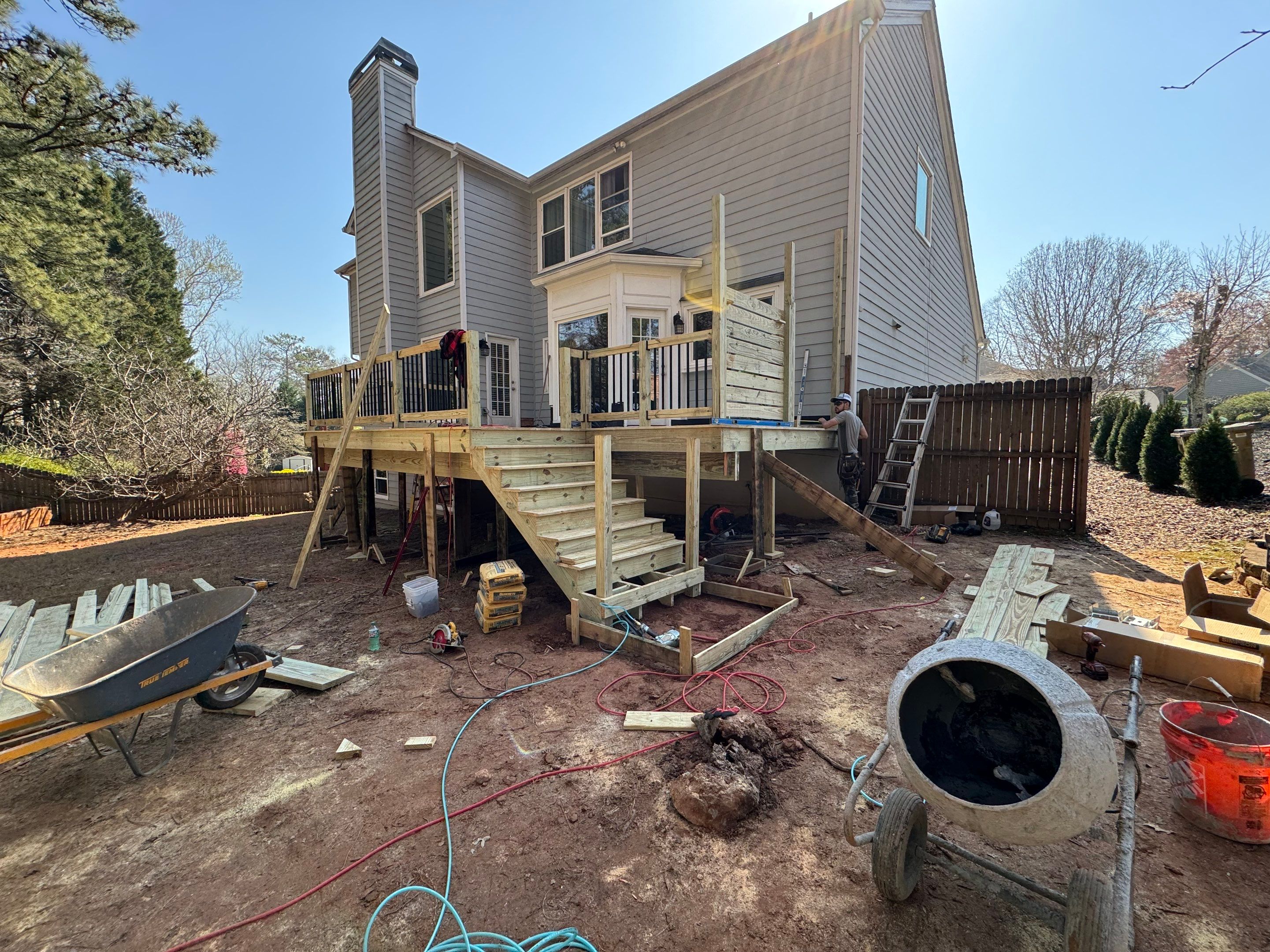 Elevated Deck Replacement with Black Metal Railings in Johns Creek by Swift Home Renovations