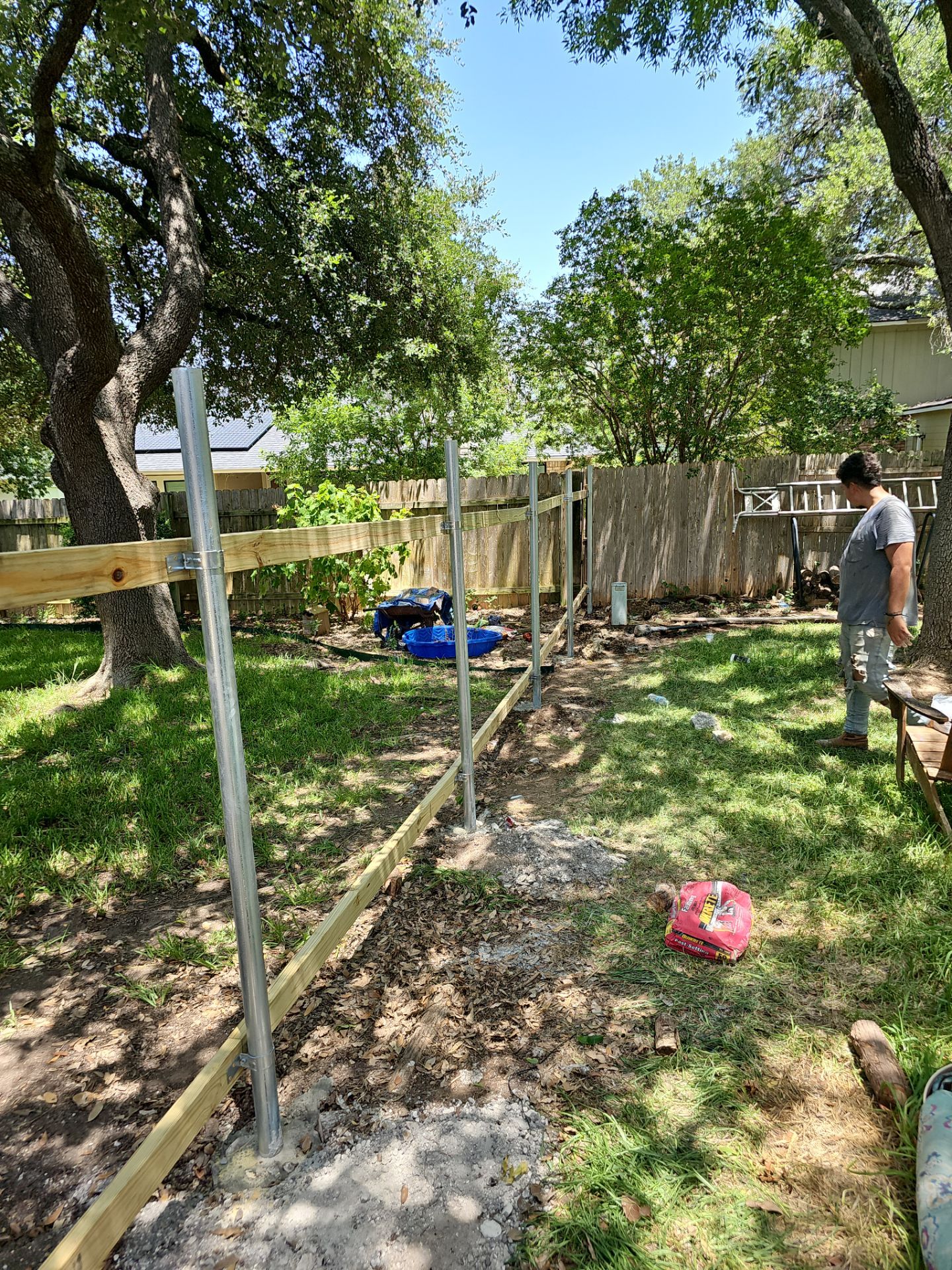 Fence Installation using Cedar Pickets by DeZign Roofing & Exteriors