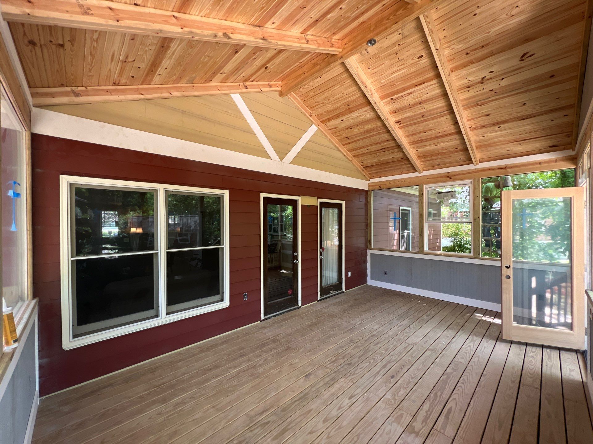 Elevated Screened-In Porch Addition with Vaulted Tongue-and-Groove Ceiling by Swift Home Renovations
