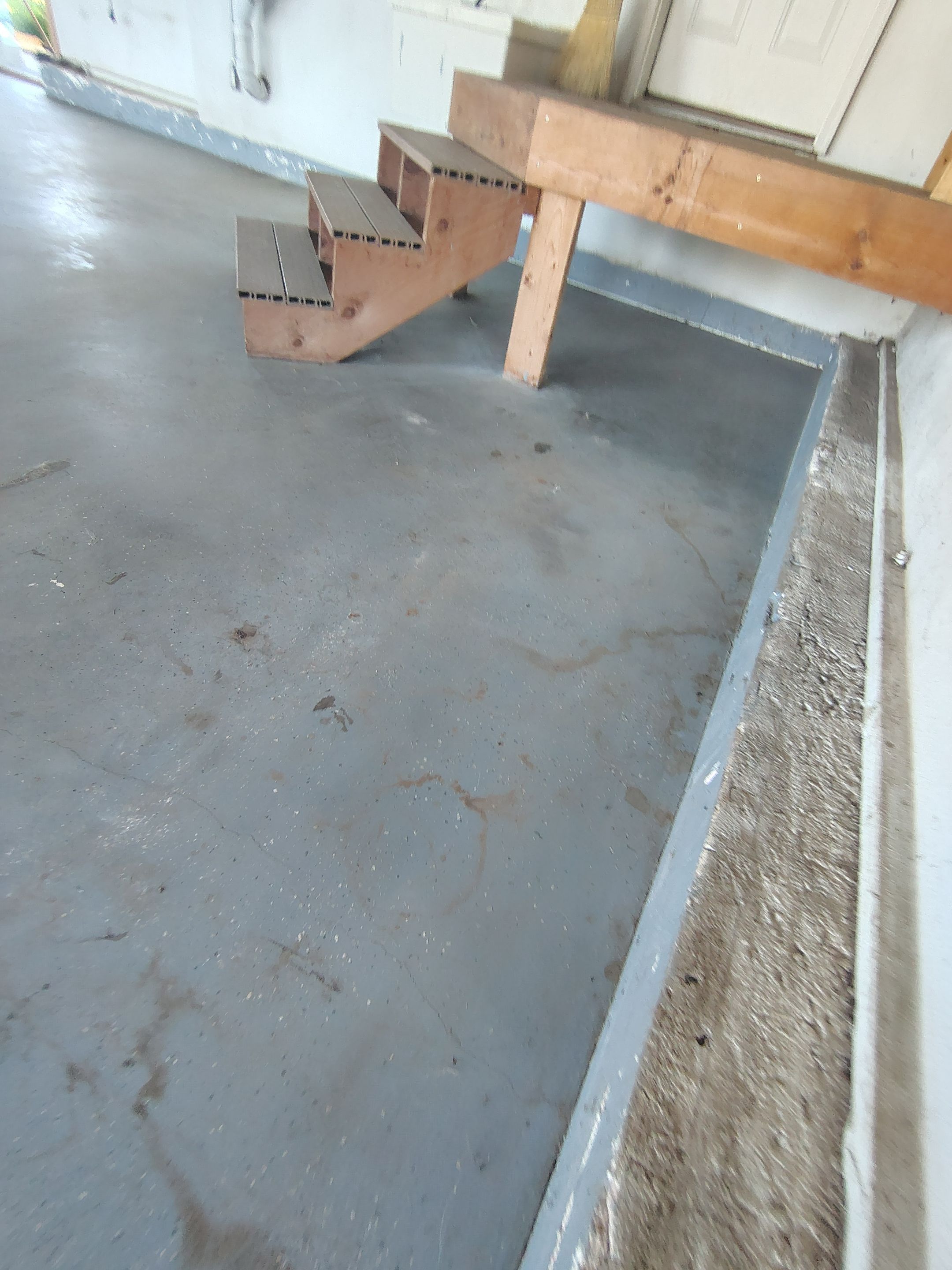 Feather Grey Garage Floor Coating Installation in Valley Springs by Select Painting, Coatings & Garage Cabinets