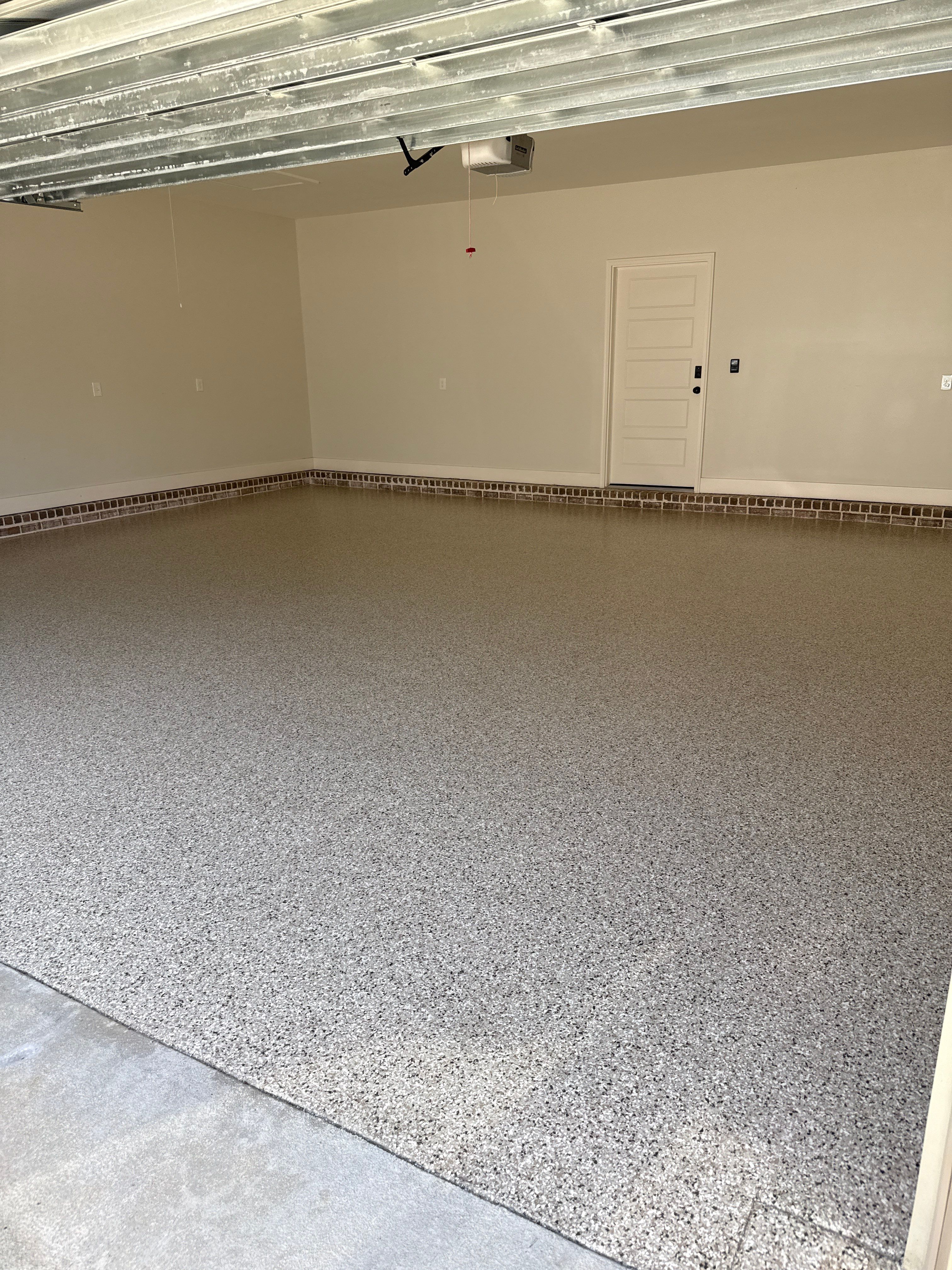 Decorative Stained Concrete Overlay and Garage Floor Coating in Mobile by Cornerstone Hard Surface Restoration 