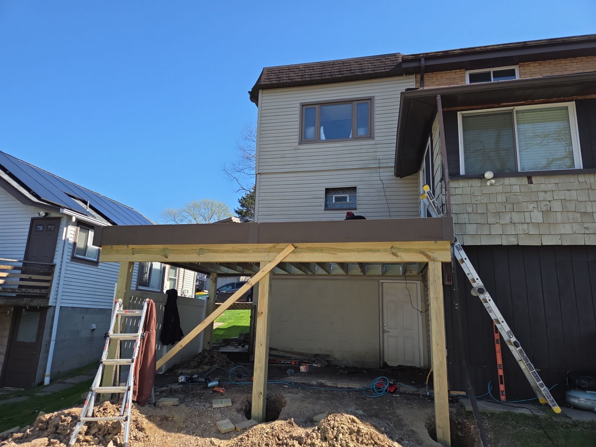 Custom Composite Deck and Wood-Plank Stamped Concrete Patio in Pittsburgh by Cousins Roofing Siding & Decks