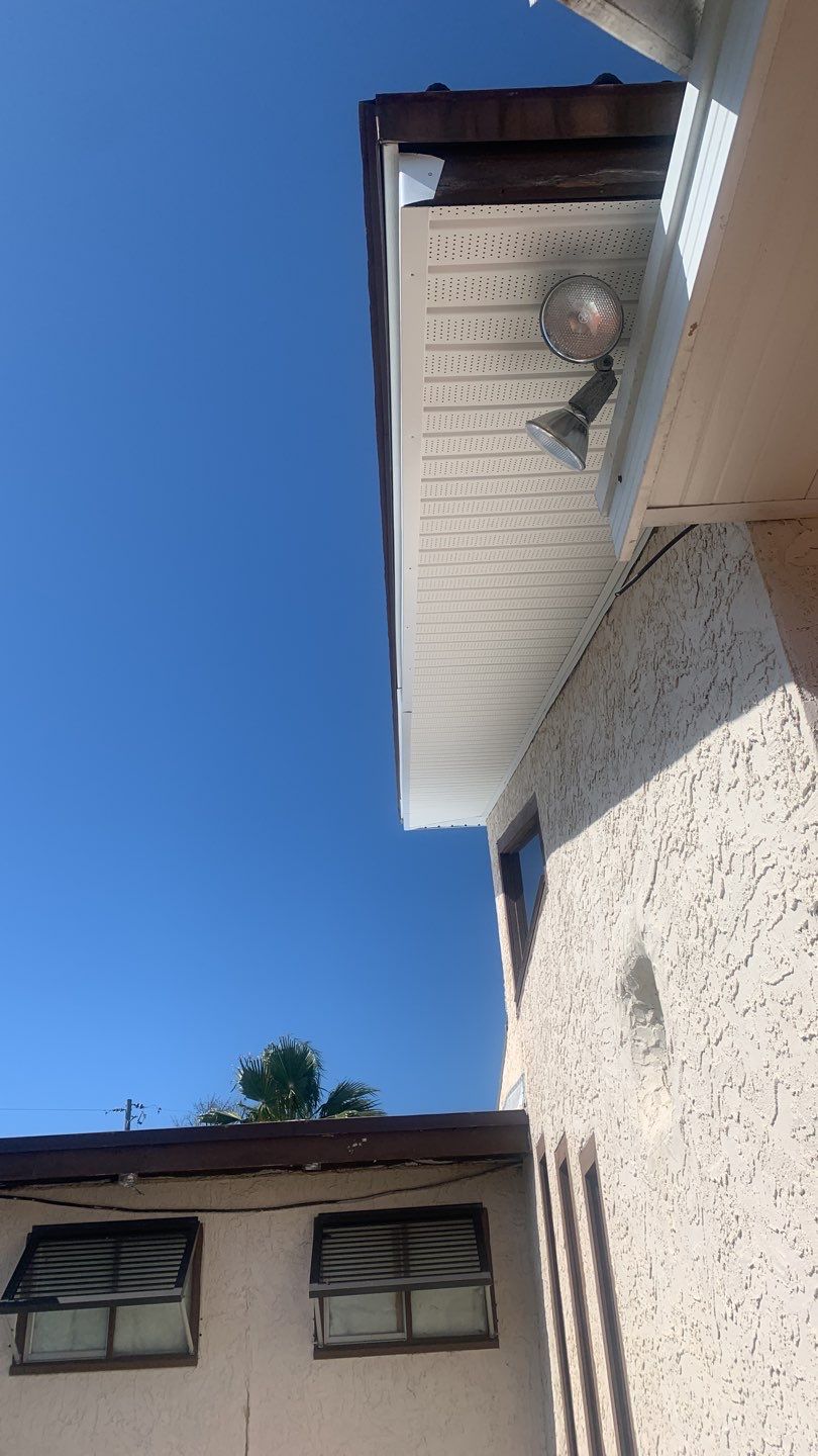 Soffit and Fascia Installation Using White Vinyl Soffit and Musket Brown Fascia by Gutter Professors