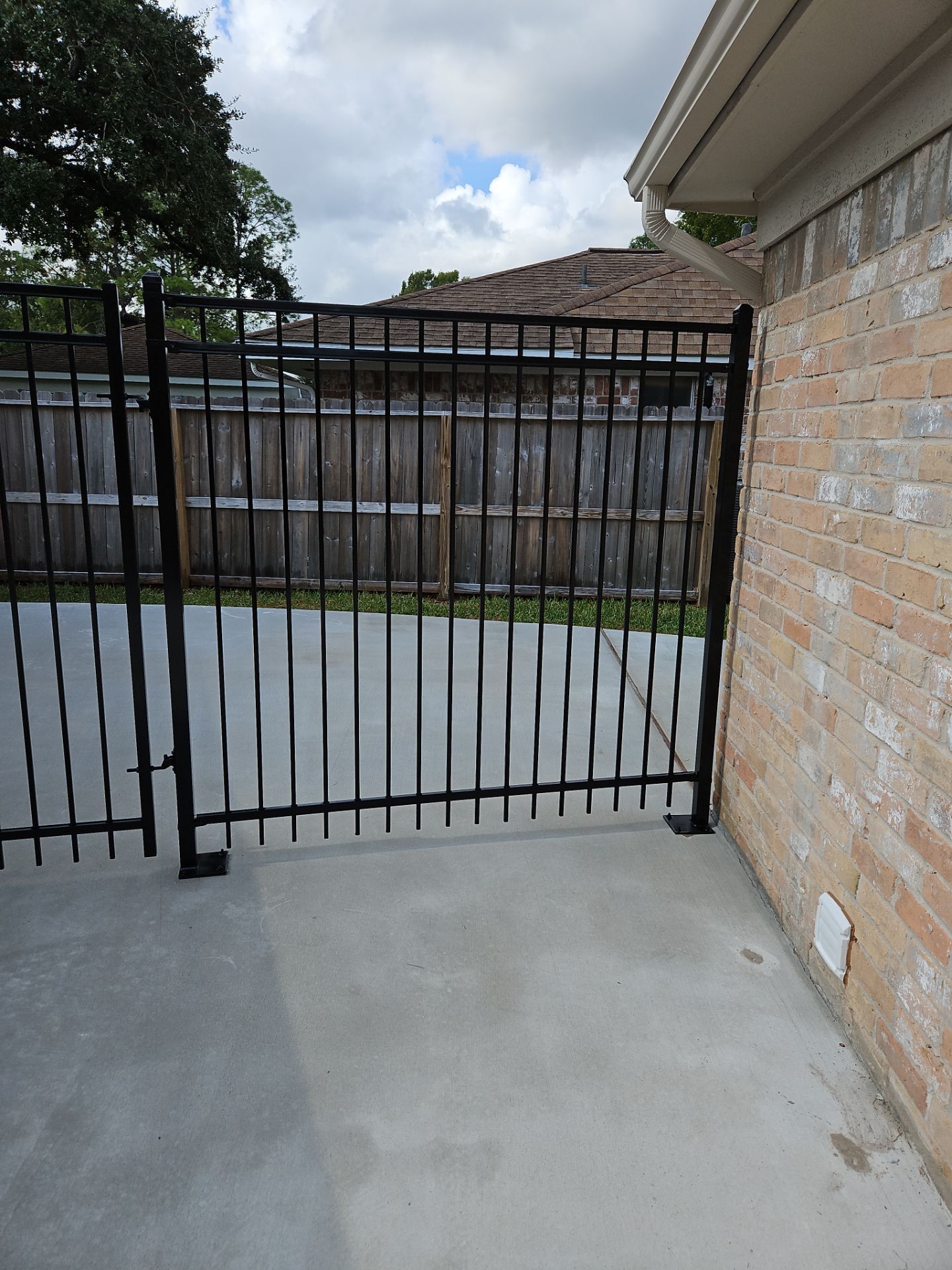 Iron fence installation using 6ft - 3 Rail - Ameristar Montage by Tim's Fences