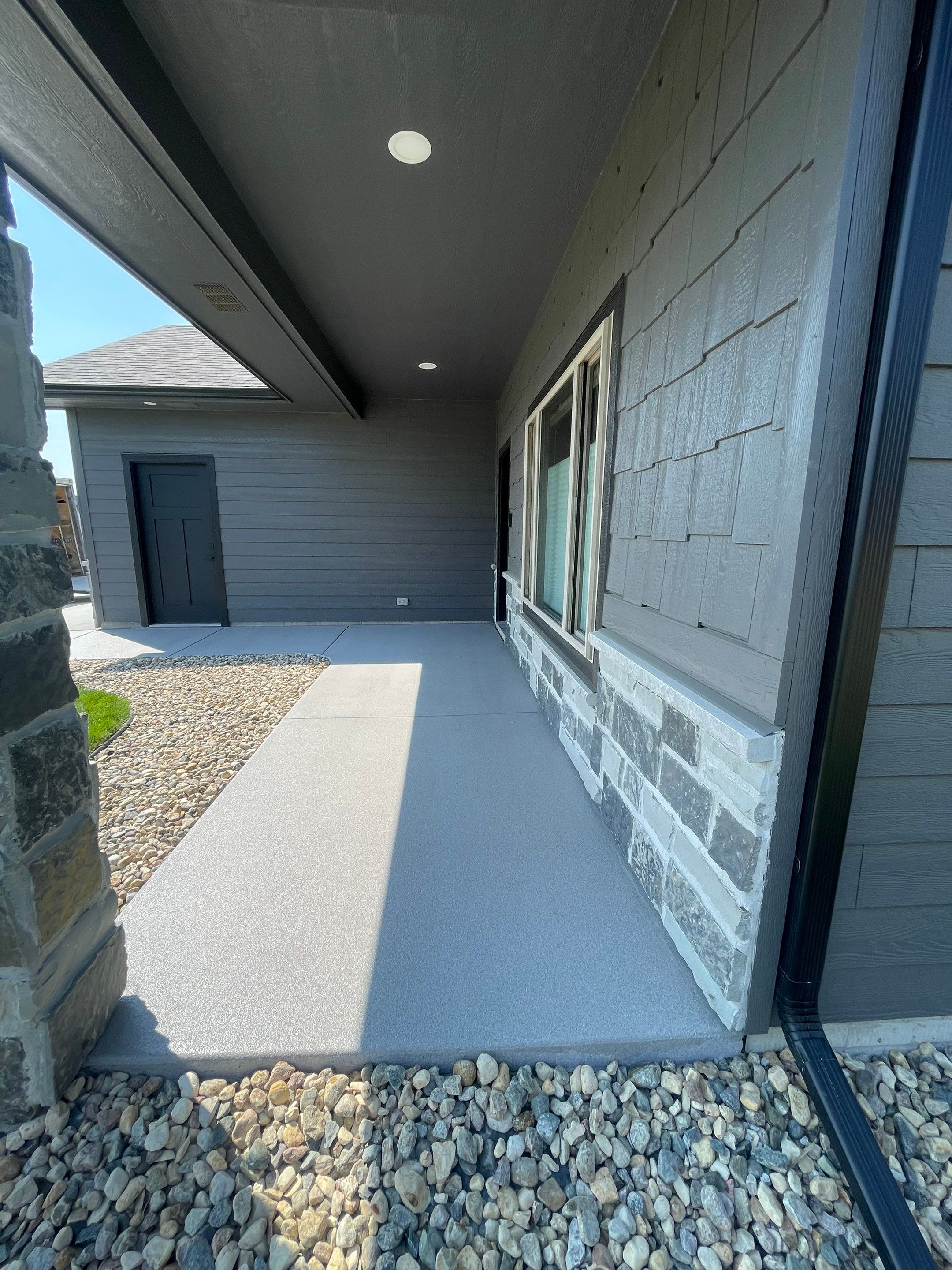 Sioux Falls Residential Concrete Patio and Walkway Coating by Select Painting, Coatings & Garage Cabinets