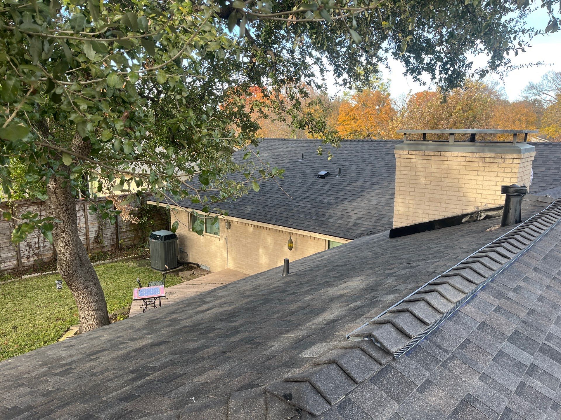 IKO Brownstone- White Brick  by Tejas Roofworks + Restoration