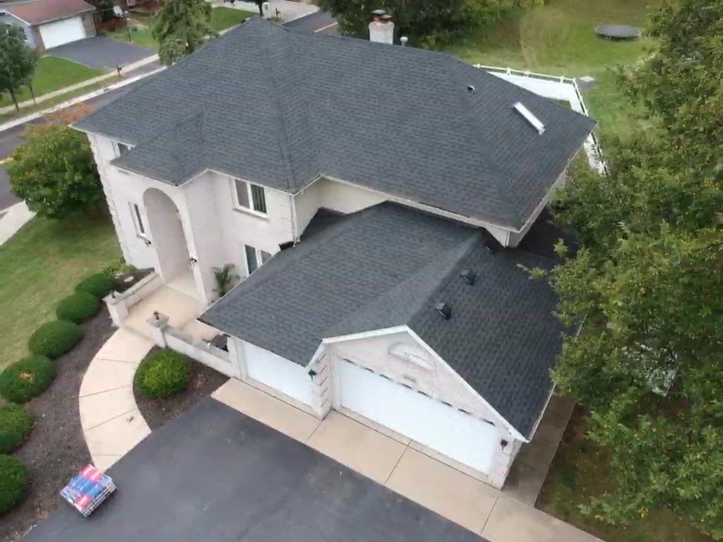 Roof and windows by Optimal Home Improvement 