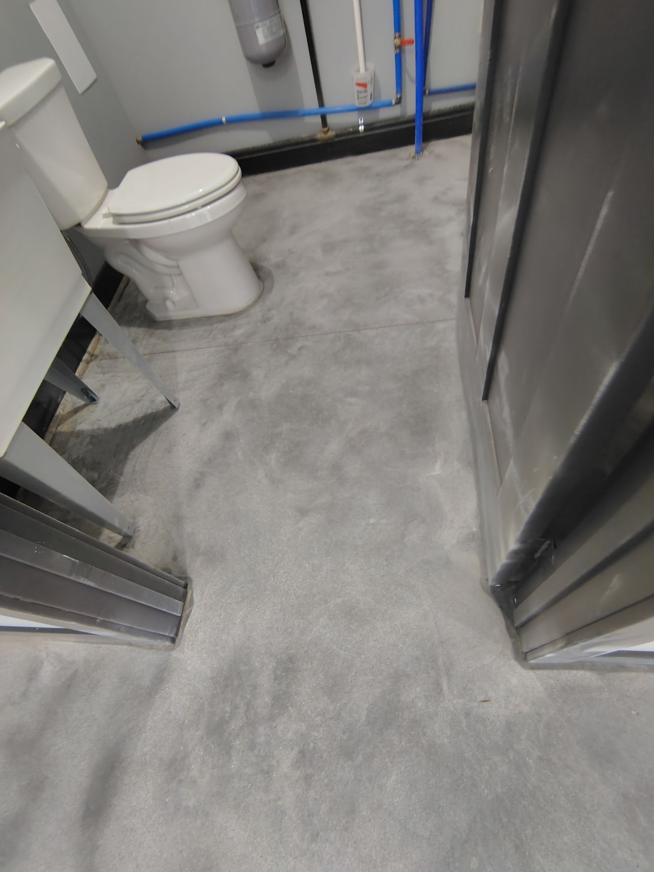 Polyaspartic Garage Floor Coating with Decorative Flake in Wentworth by Select Painting, Coatings & Garage Cabinets