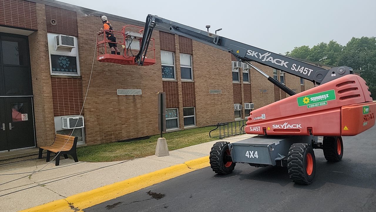 Commercial brick exterior cleaning by Northern Power Washing LLC.