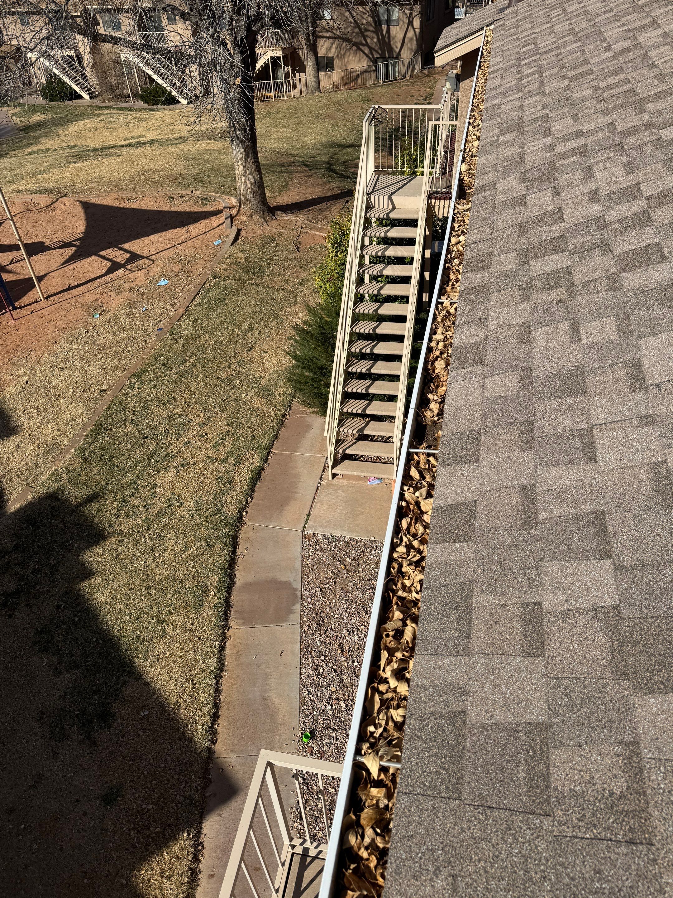 Commercial gutter cleaning Henderson, NV before photo with filled gutters