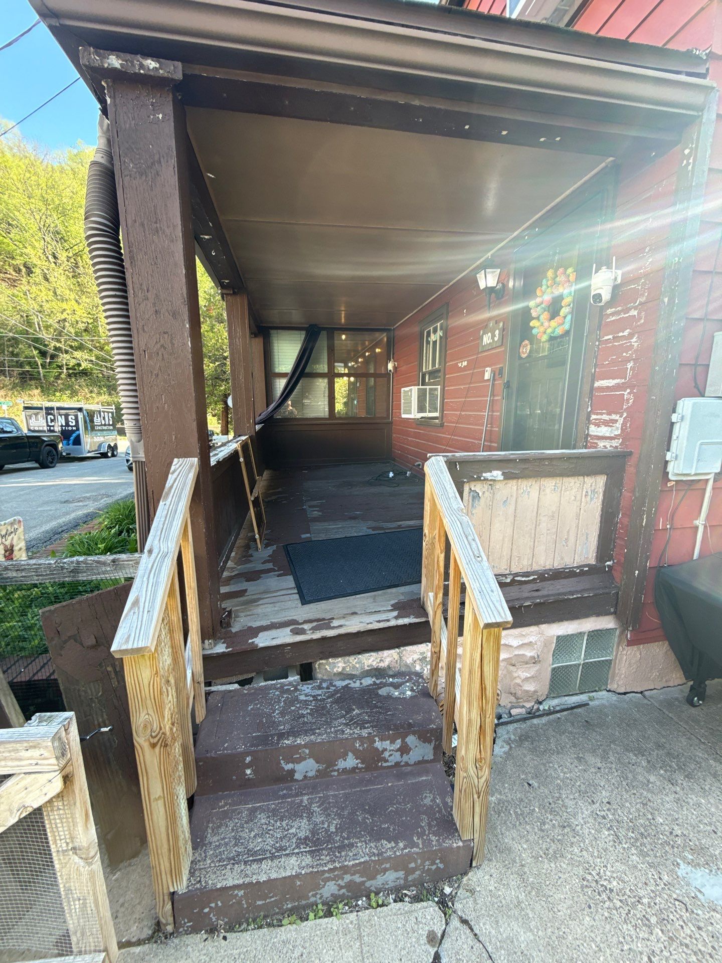 Roof sunspace deck  by Cousins Roofing Siding & Decks