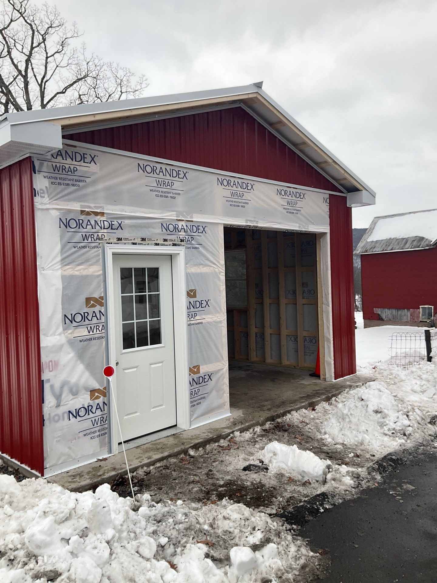 New Red Metal Garage Construction and Residential Window Replacement in Ashland by Esh Builders