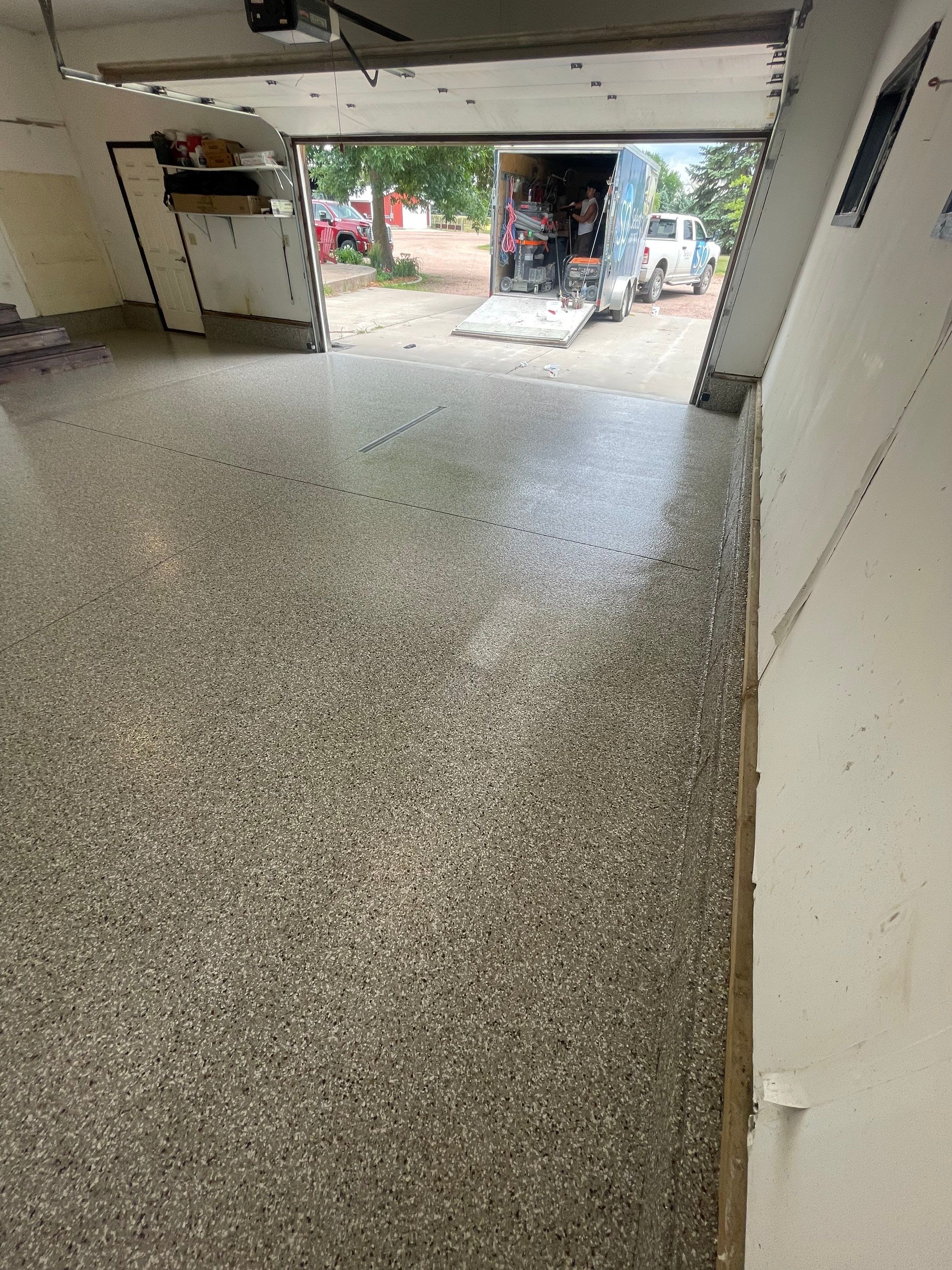 Hartford Residential Garage Floor Transformation With Decorative Chip Coating by Select Painting, Coatings & Garage Cabinets