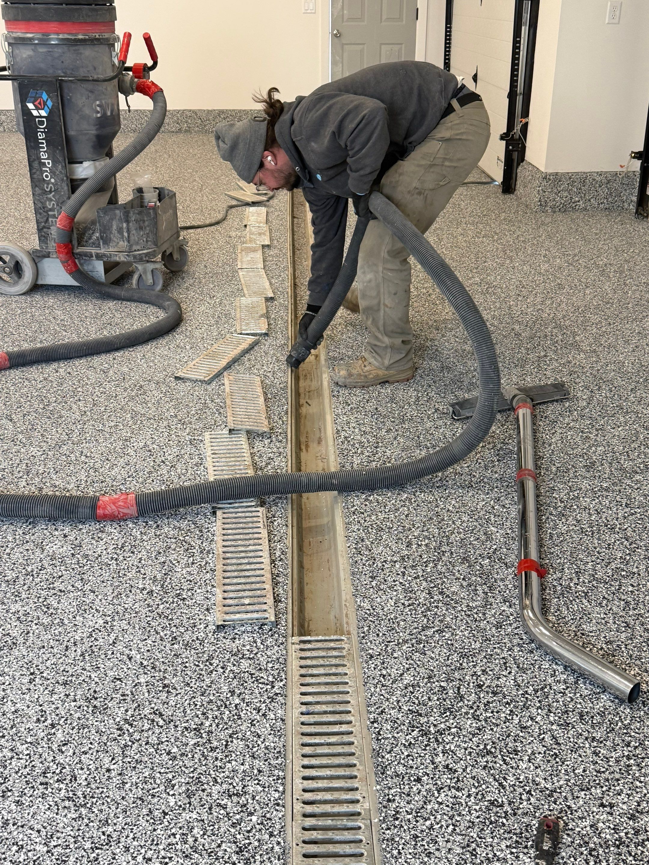 Multi-Car Garage Epoxy Floor Coating and Concrete Finishing in Sioux Falls by Select Painting, Coatings & Garage Cabinets