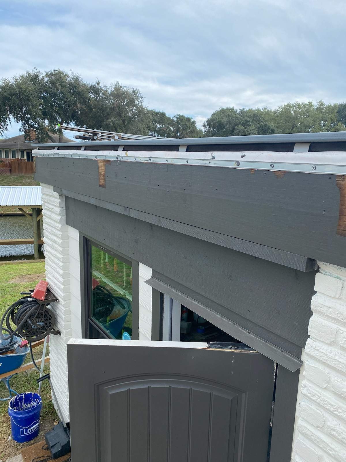 Walk Out Patio Cover by Bayfront Roofing and Construction