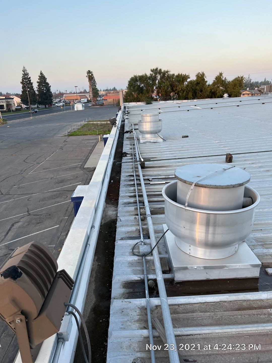 Metal roof restoration on commercial roof using Conklin Benchmark/ PUMA XL acrylic coatings over metal and foam by Straight Edge Roofing Inc