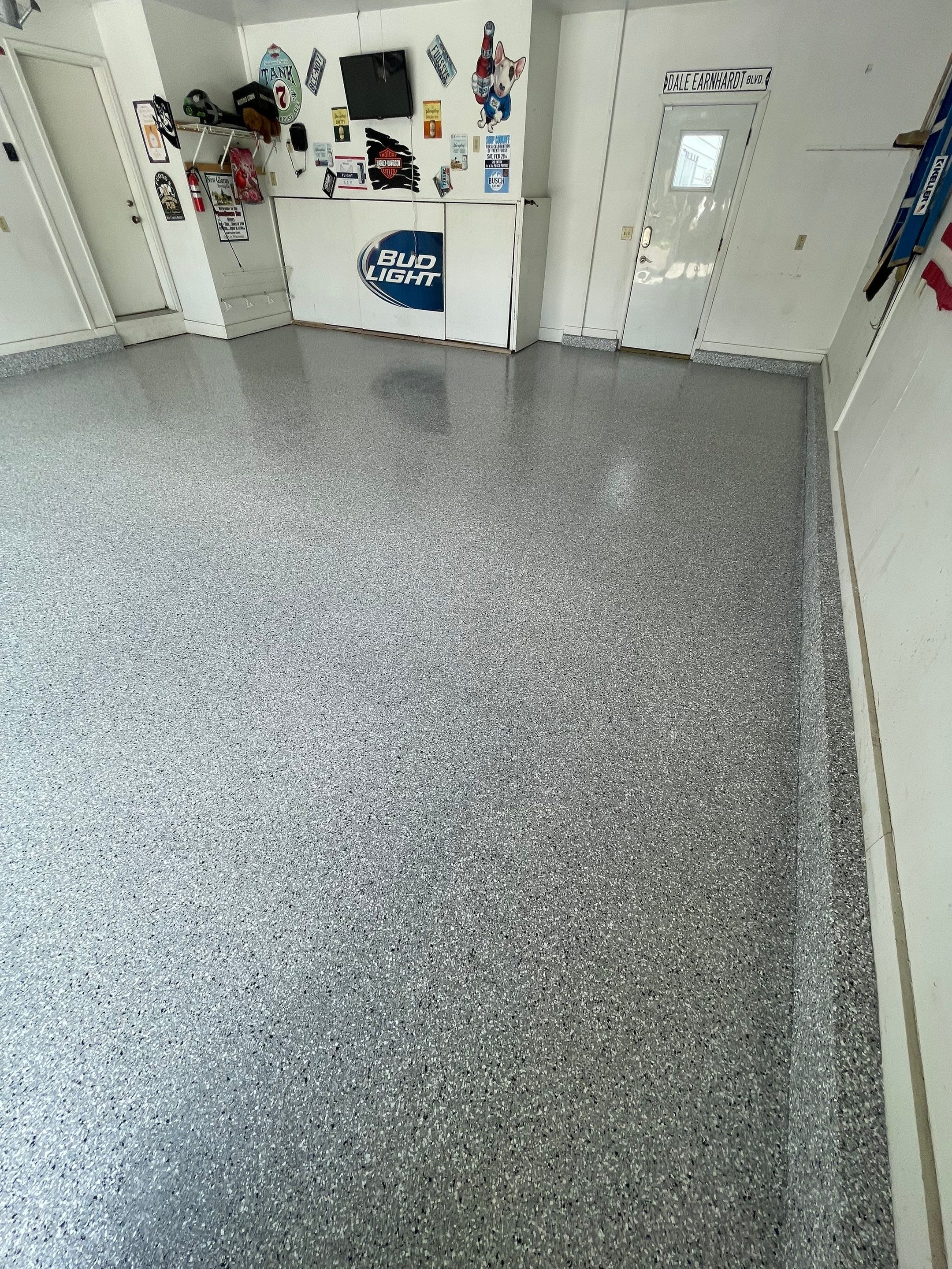 Residential Garage Floor Coating with Feather Grey Finish in Sioux Falls by Select Painting, Coatings & Garage Cabinets