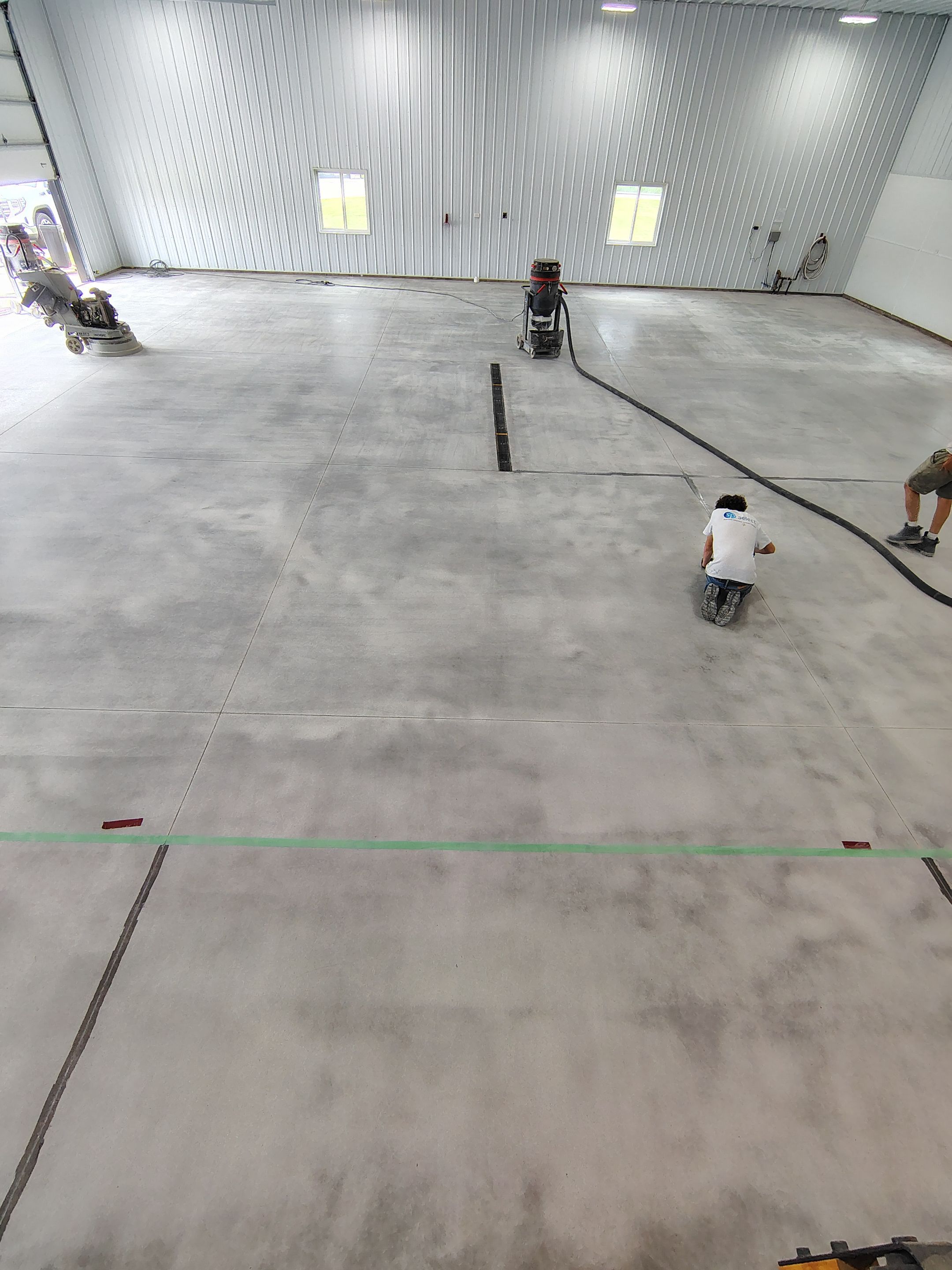 Multi-Stage Concrete Floor Coating for Egan Shop and RV Storage by Select Painting, Coatings & Garage Cabinets
