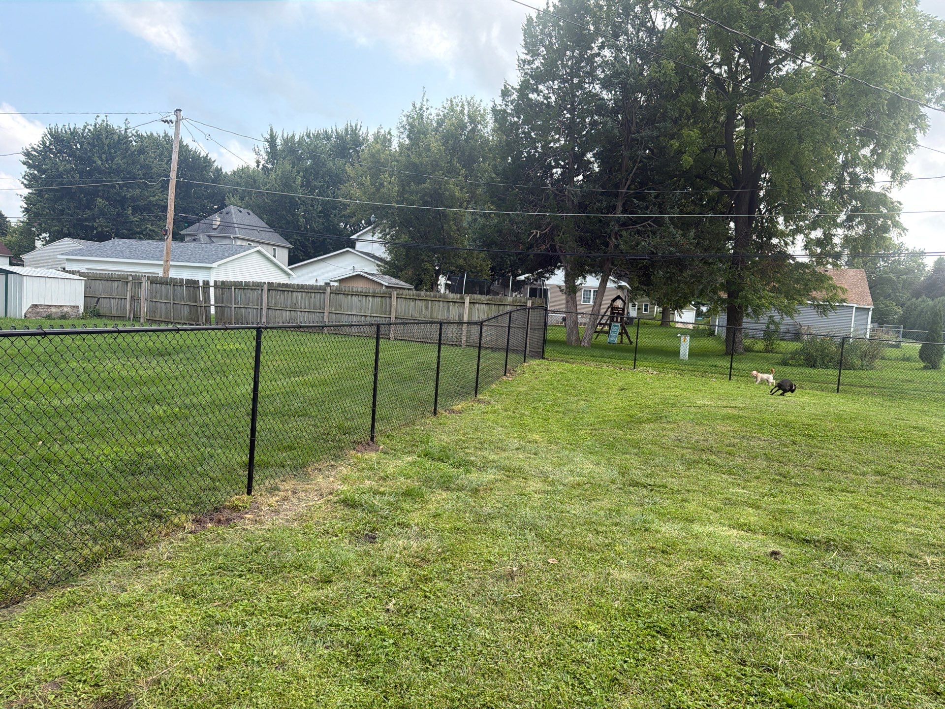 Residential Black Chain Link Fence Installation in Reinbeck by Perfect Picket Fence and Stain