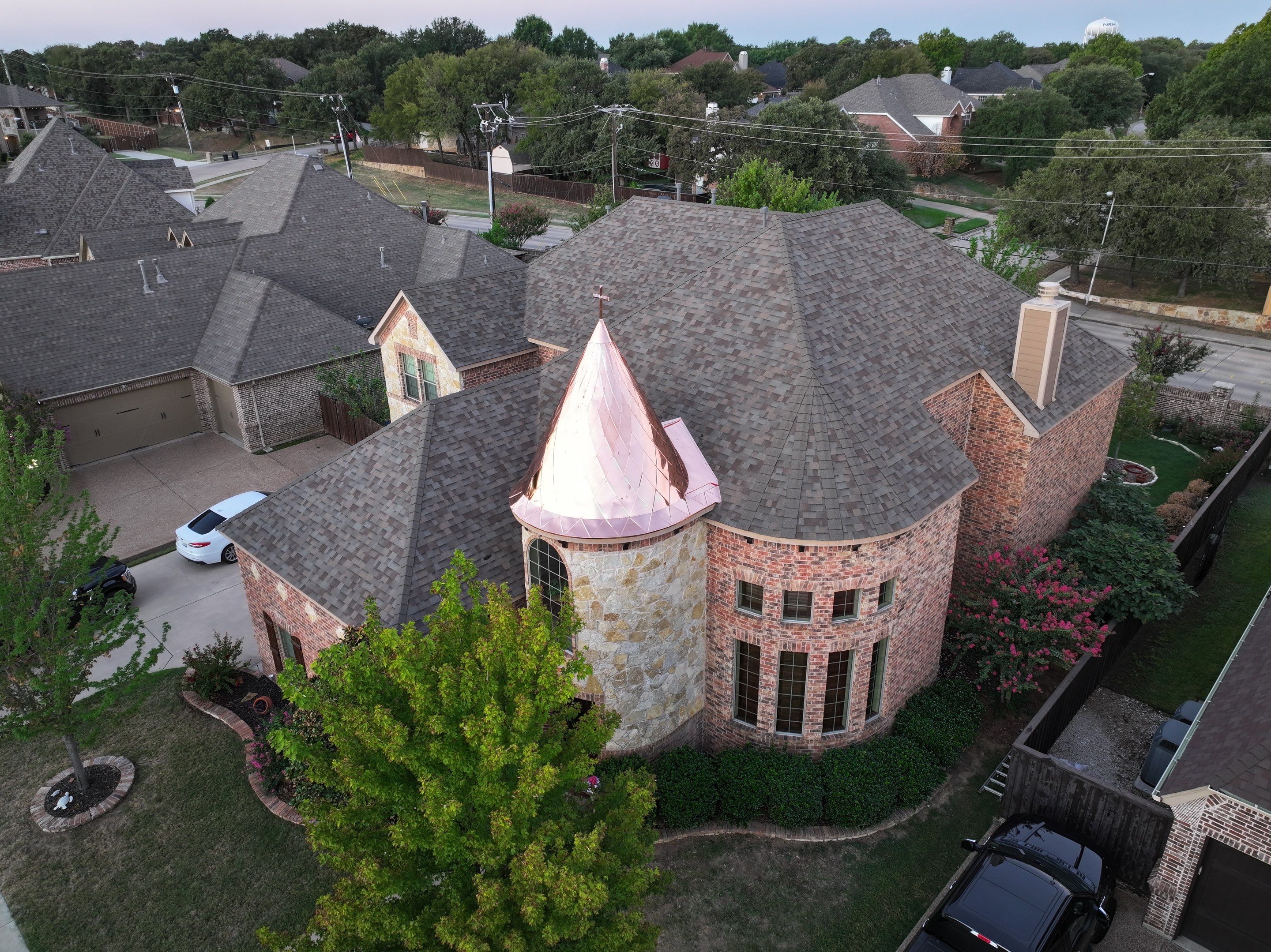 Installing Custom copper turret and Malarkey Vista Class 4 shingles Hail Damage Upgrade by Becker Roofing and Exteriors