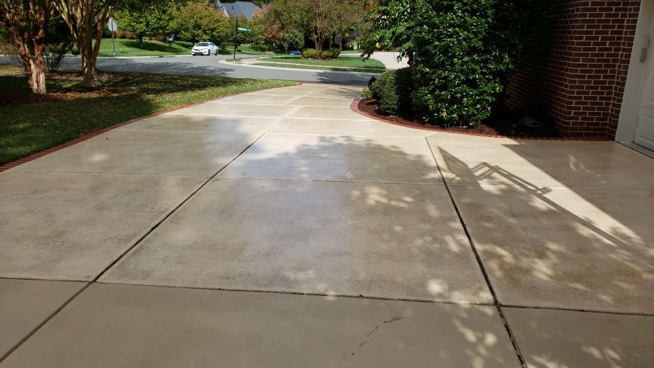 Driveway Clean using cleaner by Power Wash Masters LLC