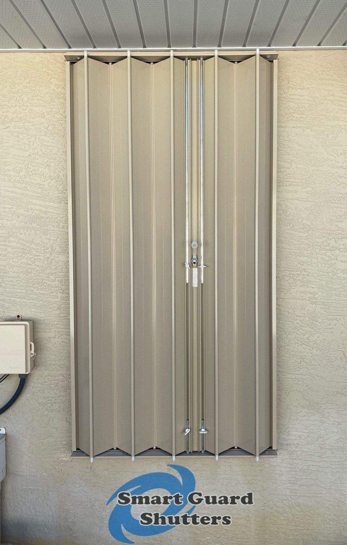 Accordion Shutters in Beige by Smart Guard Shutters