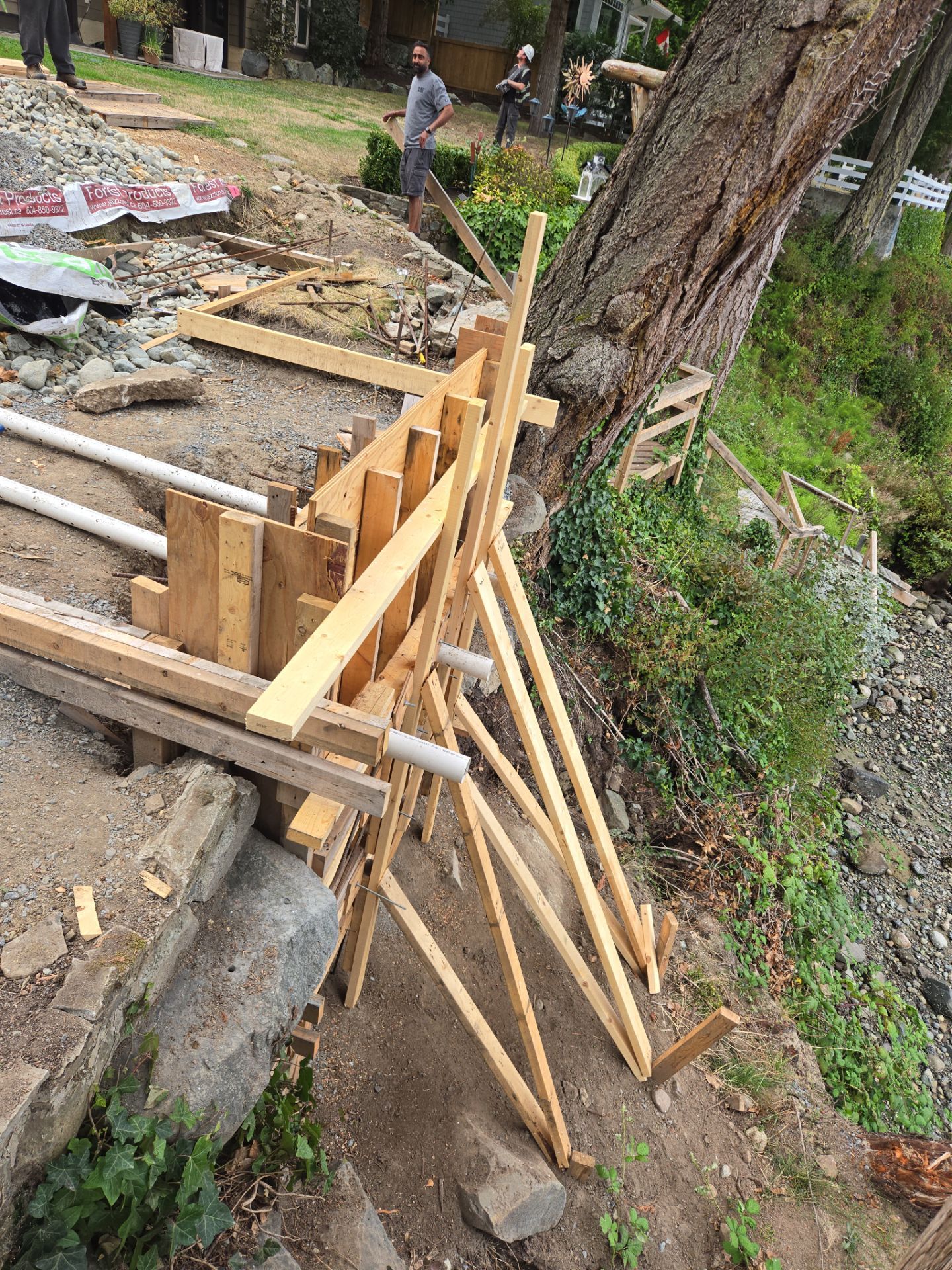 Coastal Landscape Restoration & Retaining Structure - In progress by Habanero Garden and Exterior Care