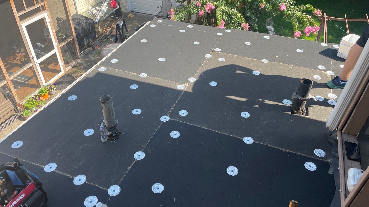 Rubber Roof and Gutter on Addition  by Secure Construction Company Inc