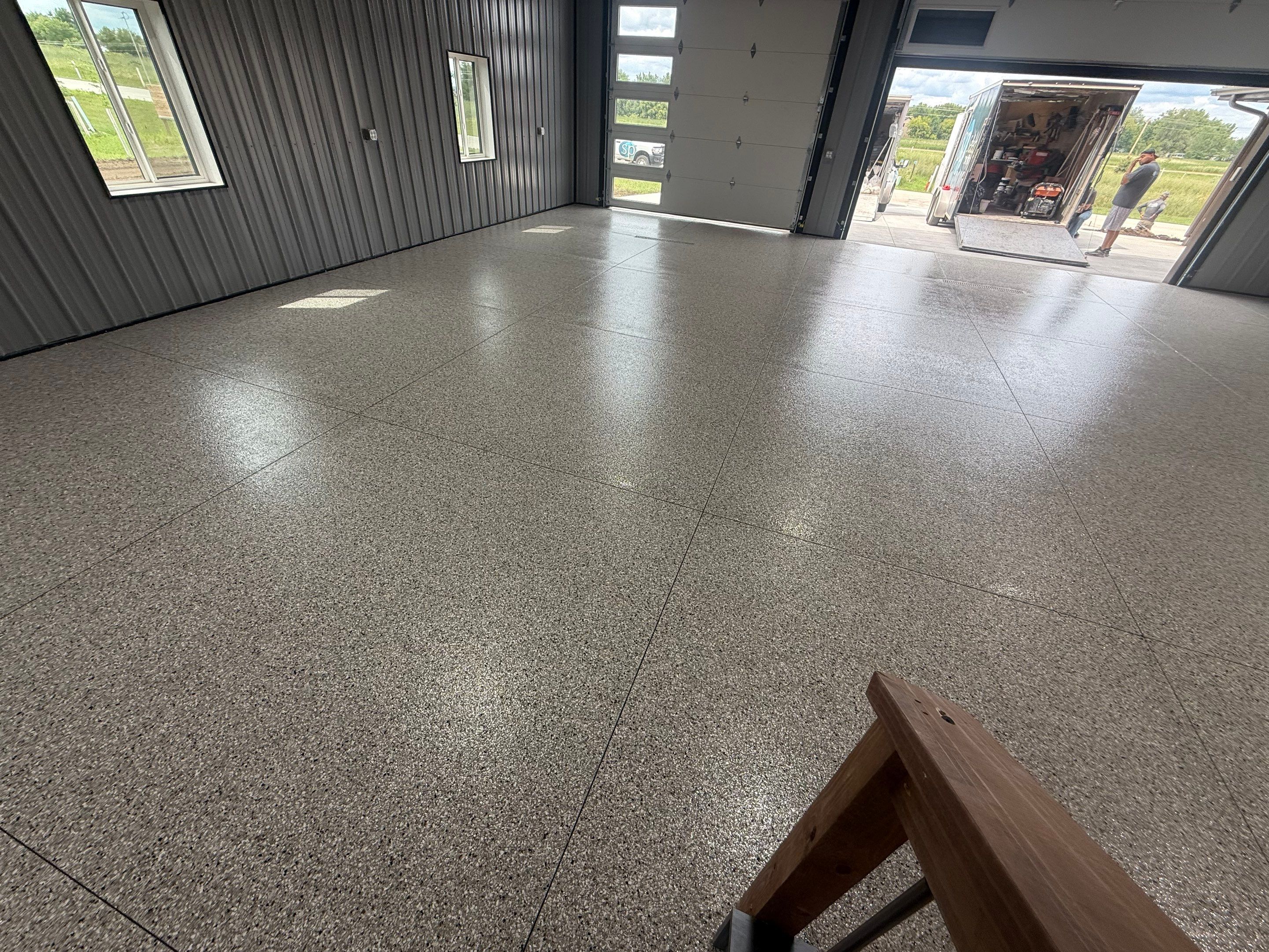 Polyaspartic Garage Floor Coating with Decorative Flake in Wentworth by Select Painting, Coatings & Garage Cabinets