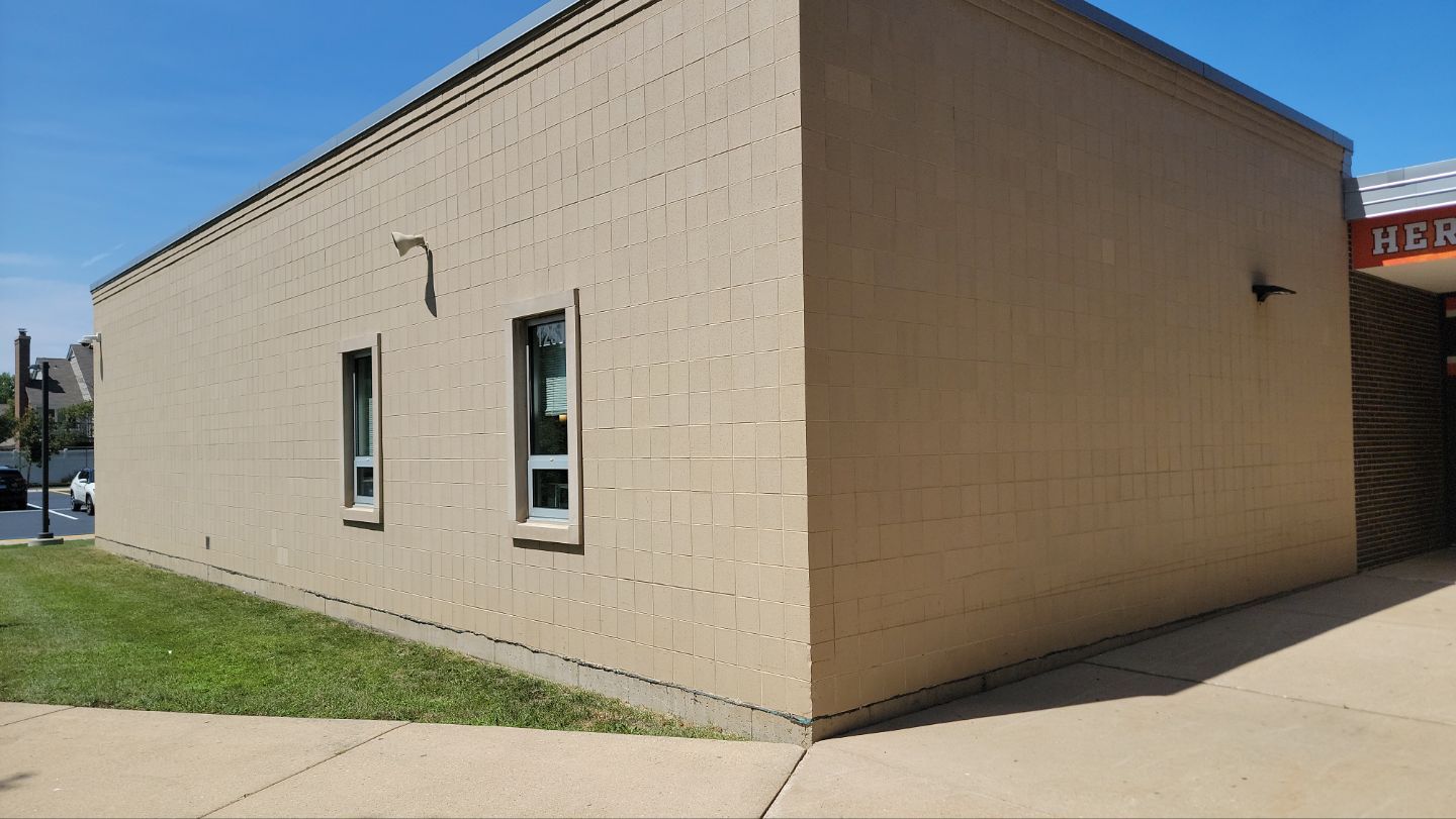 commercial pressure washing using Algaecide, soft wash soap by Northern Power Washing LLC.