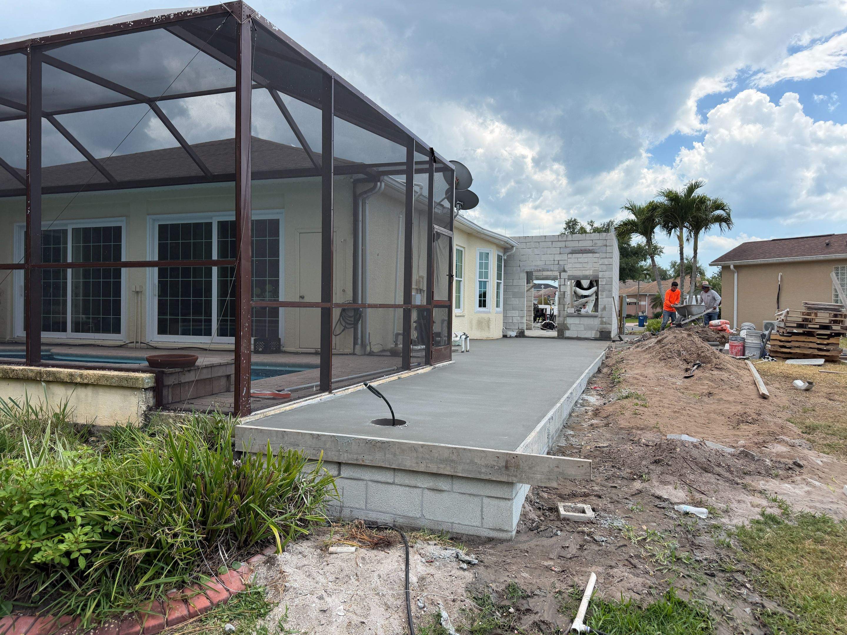 Custom Single-Car Garage Addition and Lanai Cage in Bradenton by Vertical General Contracting 