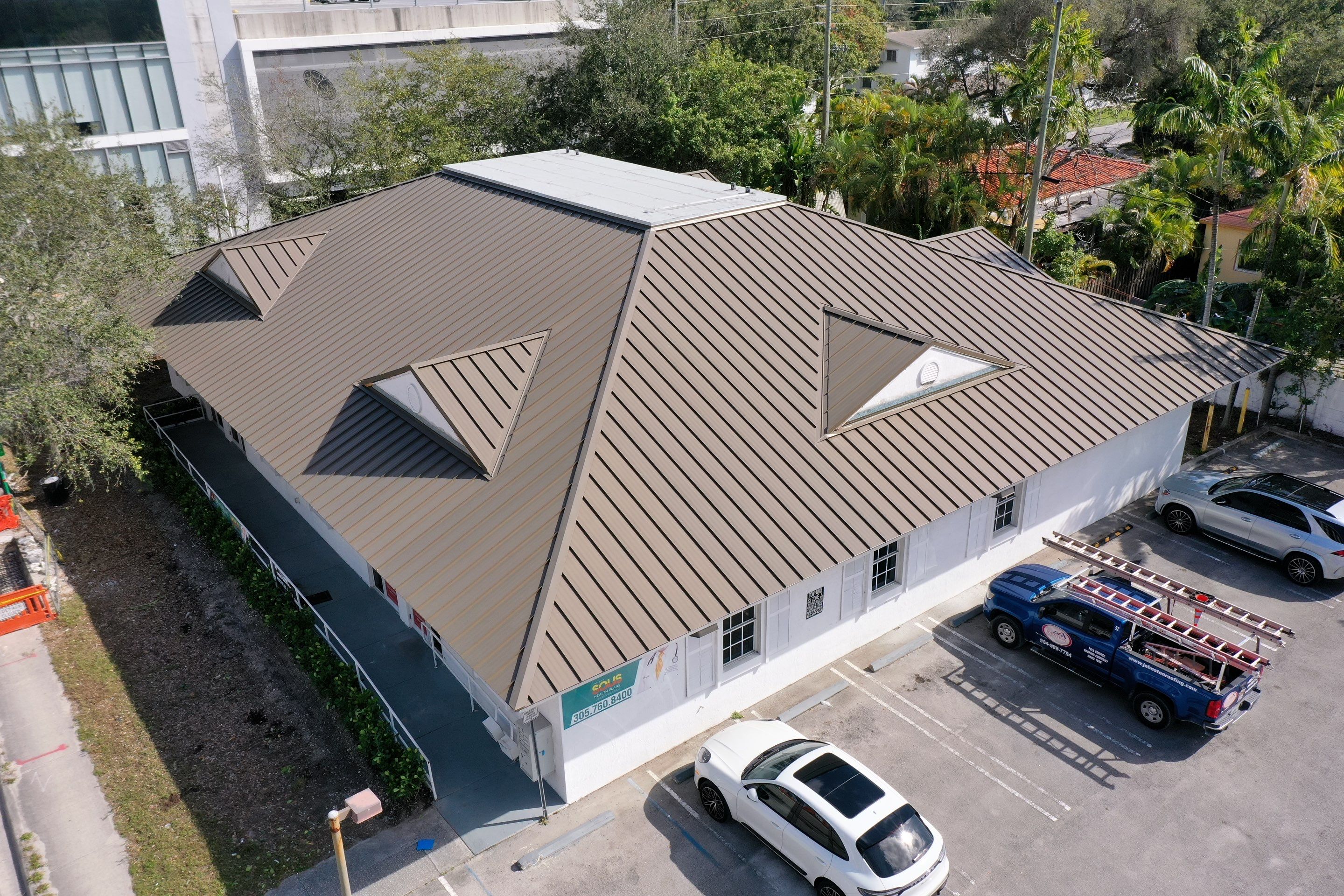 COMMERCIAL REROOF 24 GUAGE MEDIUM BRONZE 1-1/2" MECHANICAL SEAM "ZEBRA METHOD" by Earl W. Johnston Roofing 