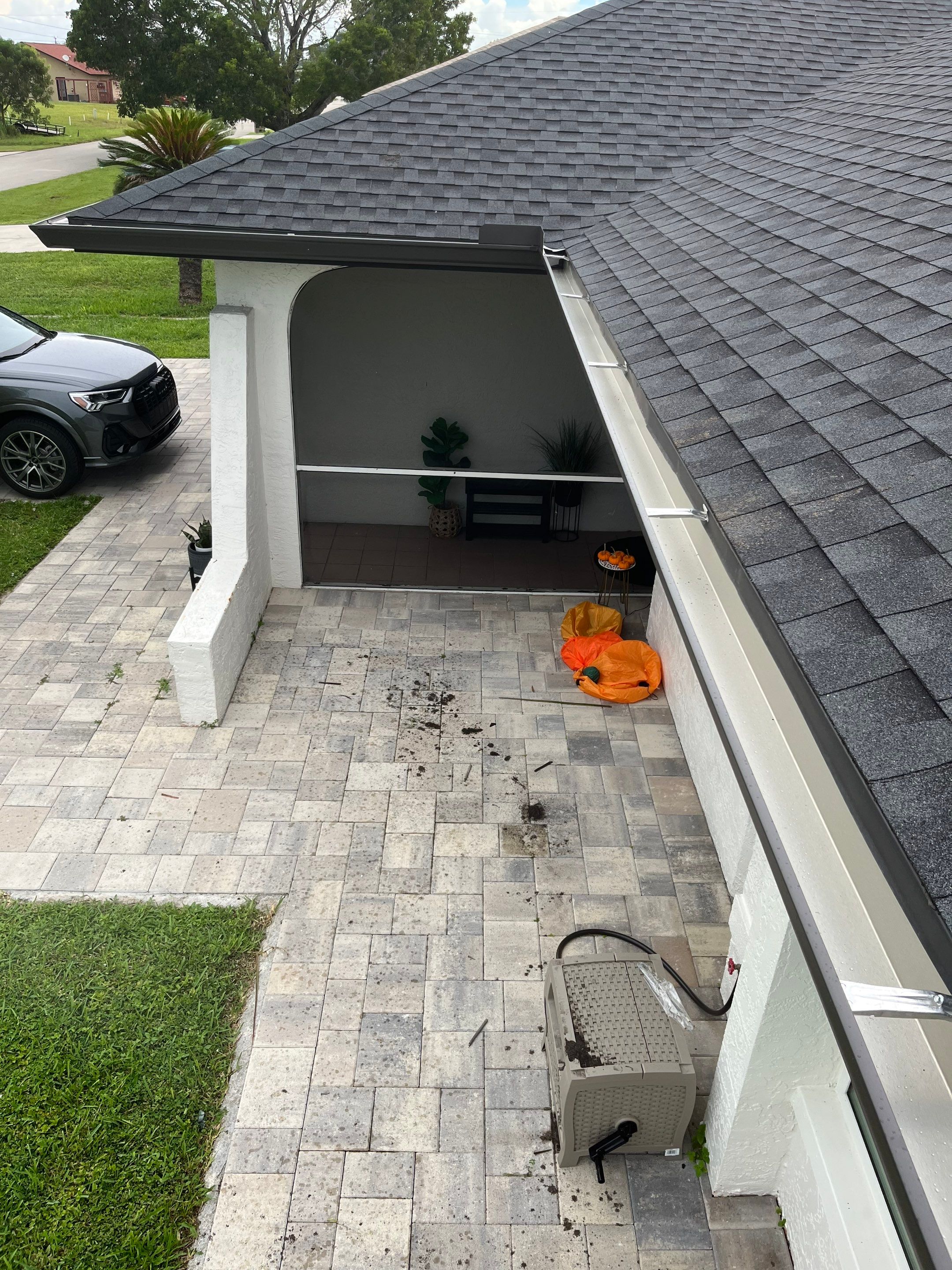 Black Seamless Gutters for a Modern Look in Cape Coral FL by Gutter Professors